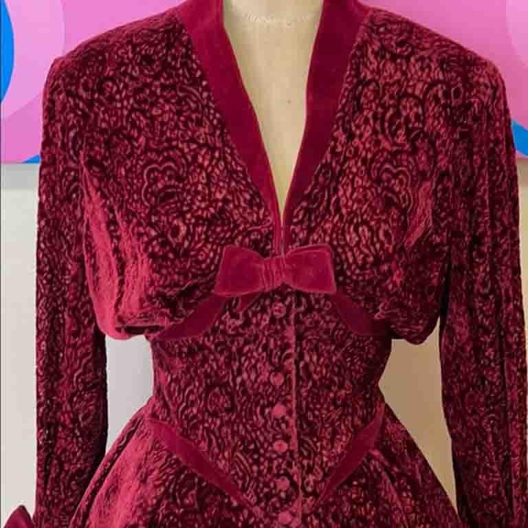 Special occasion dressing is easy wearing vintage Mugler! This stunning burgundy skirt suit has a unique lining at the jacket that allows it to stand out and have structure. Perfect for a wedding! Internal corset.

Size 38
Jacket
Across chest 19.5