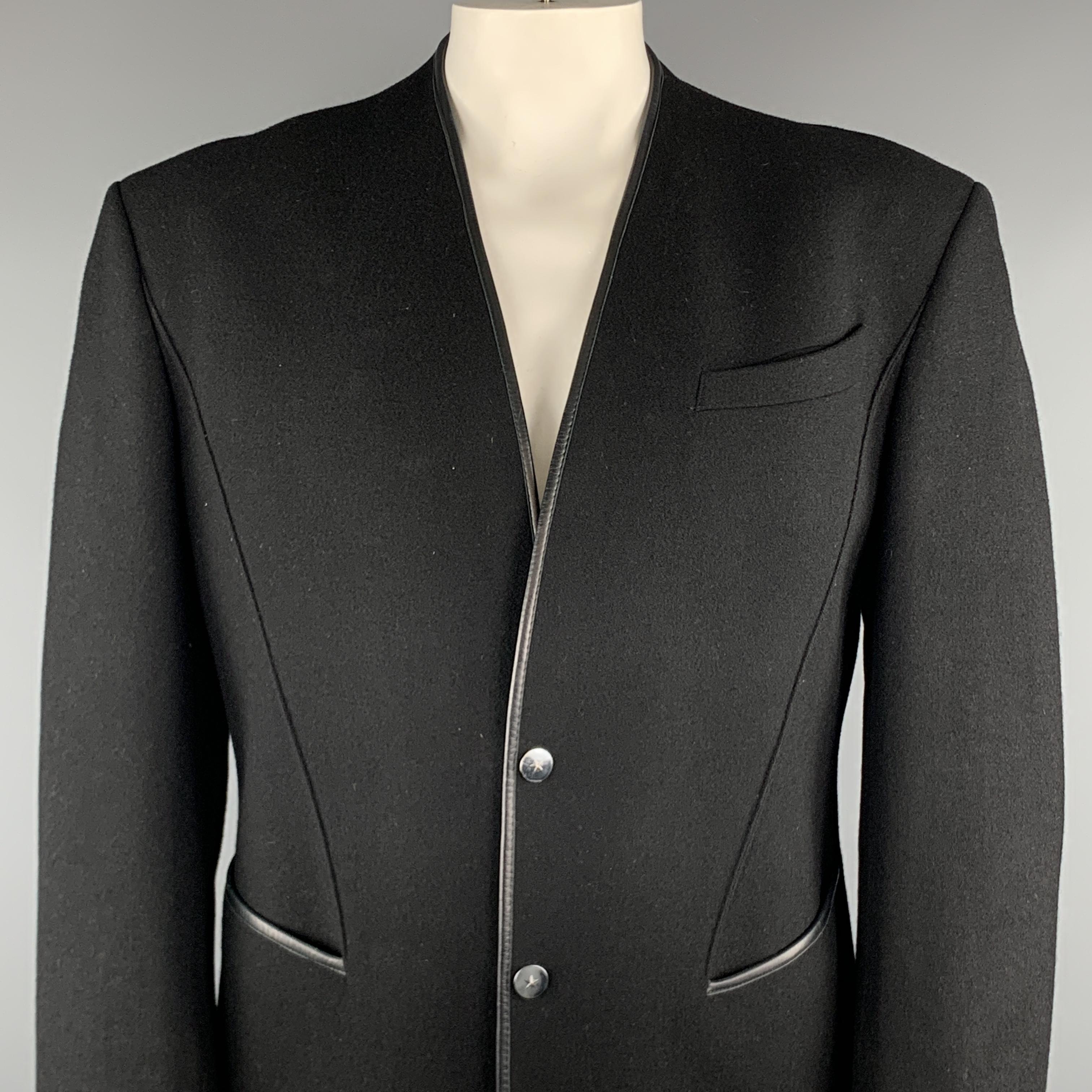 VINTAGE THIERRY MUGLER Jacket comes in a black wool blend featuring a leather trim detail, slit pockets, and a two snap button closure. Made in France. 

Excellent Pre-Owned Condition.
Marked: 52

Measurements:

Shoulder: 21 in.
Chest: 42 in.