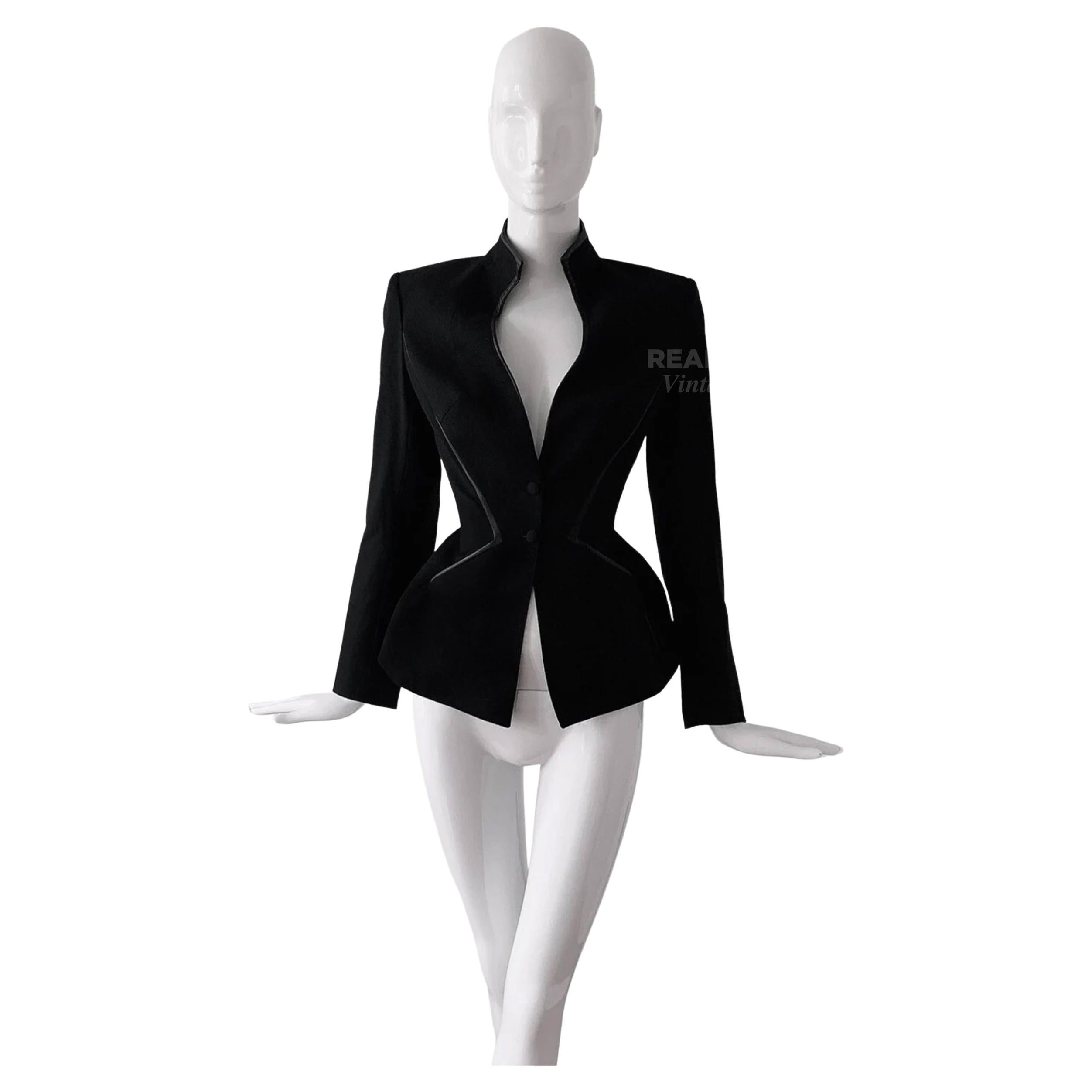 
Stunning Thierry Mugler Couture Blazer Jacket
Femme Fatale!
Super strong statement piece, deep V-neck black blazer jacket with zigzag leather details and gorgeous sculptural silhouette. Dramatic collar and neckline.
Typical Mugleresque feminine