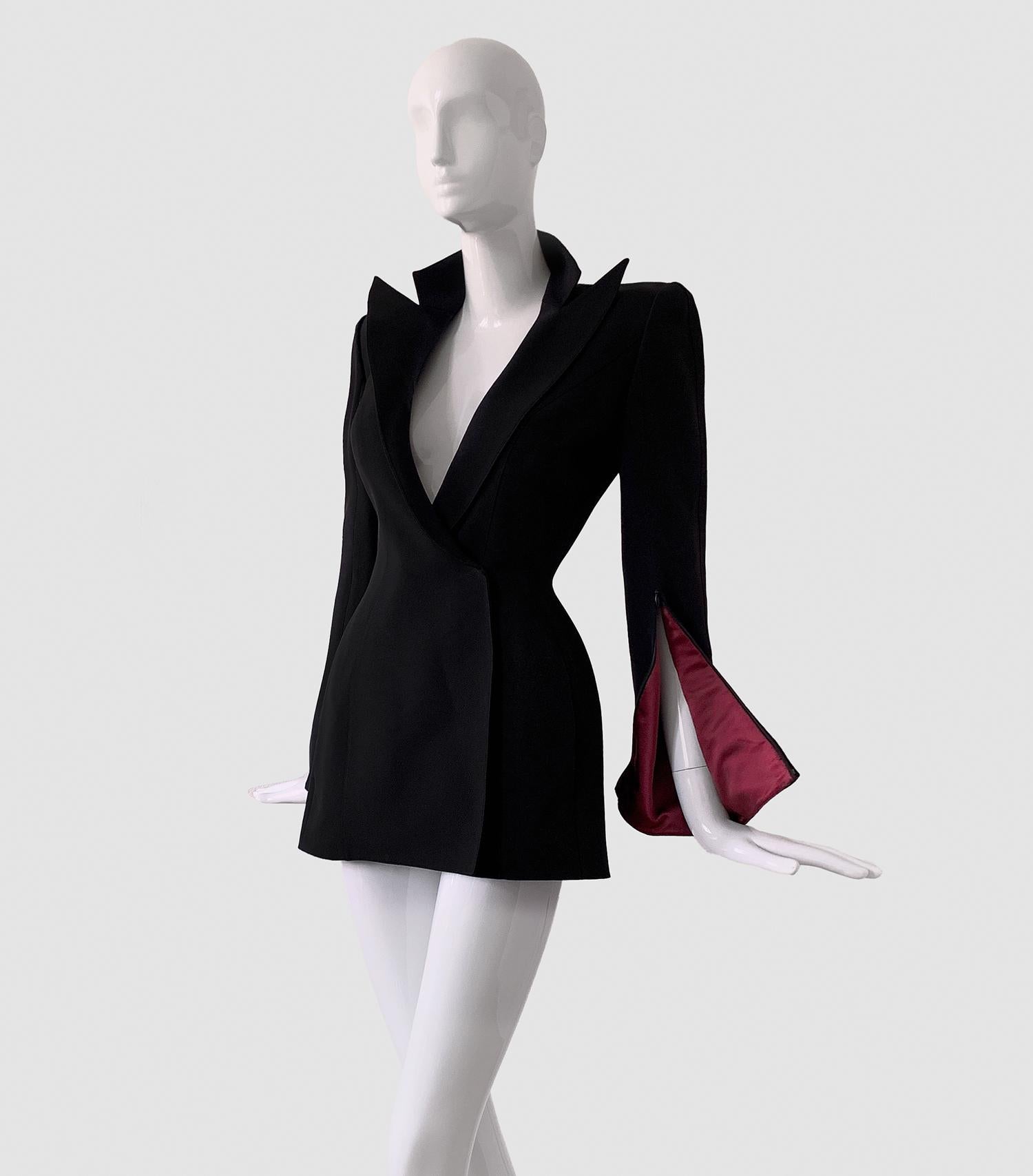 
Stunning etremely rare Thierry Mugler Couture piece

Museum worthy Collectors Piece.
Thierry Mugler Couture Blazer/Jacket Spring Summer Collection 2001.
Dramatic silk blazer with amazing surreal open sleeves. Black outside and dark red inside.  The
