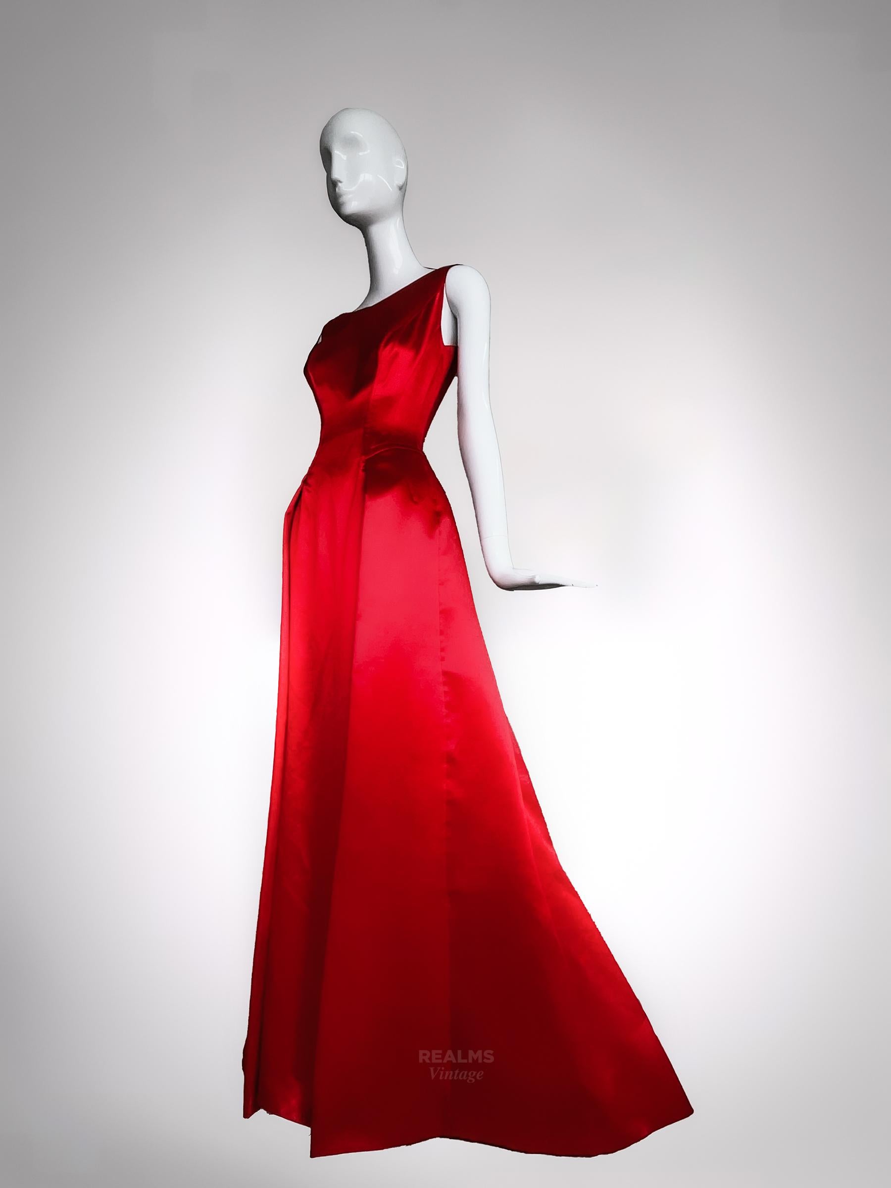 Breathtaking Thierry Mugler Couture Goddess Evening Gown 
Assuming Fall Winter 1999 Collection

The most stunning Thierry Mugler evening gown. Vibrant red made of gorgeous glowing Silk. Beautiful open V décolleté, bustier-like tailored bodice