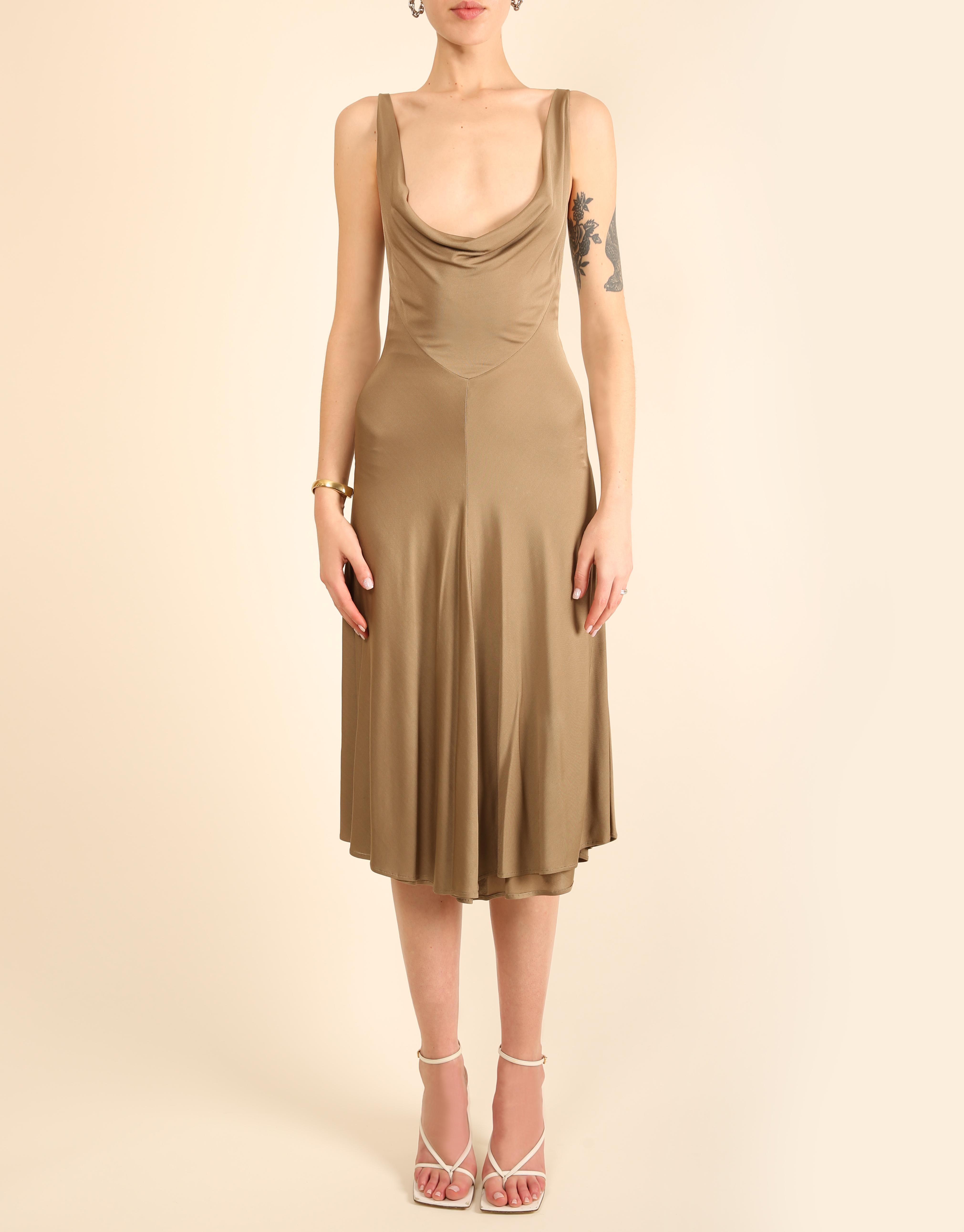 Thierry Mugler Couture sleeveless midi length dress in taupe
Fitted upper with a flared skirt
Stretch fabric
A very low cut draped plunging neckline 
Double lined

Size:
No size label - estimated to fit a FR 34 - 36, but pleaser refer to the