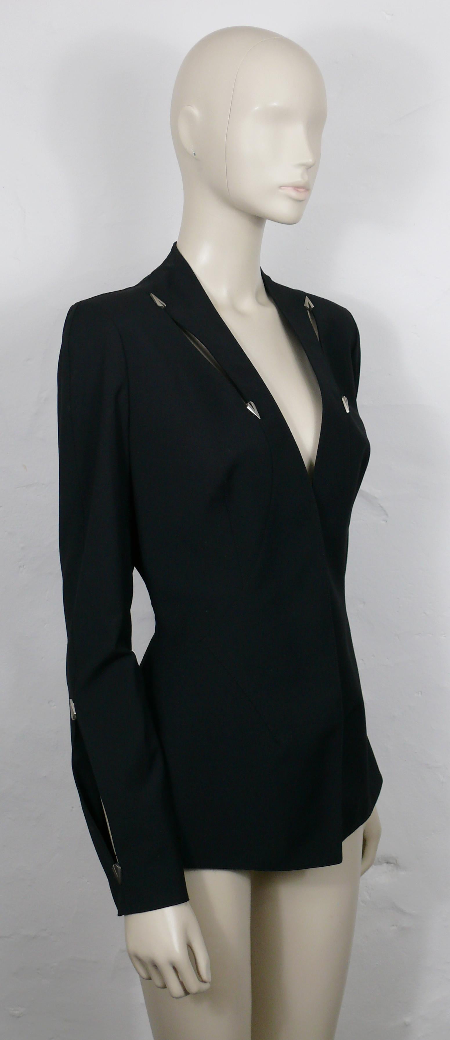 THIERRY MUGLER Couture vintage spring/summer black supple jacket featuring cut-outs on front, forearms and back embellished with brushed silver tone arrowhead details.

This jacket is typical from THIERRY MUGLER's sculptural cut and