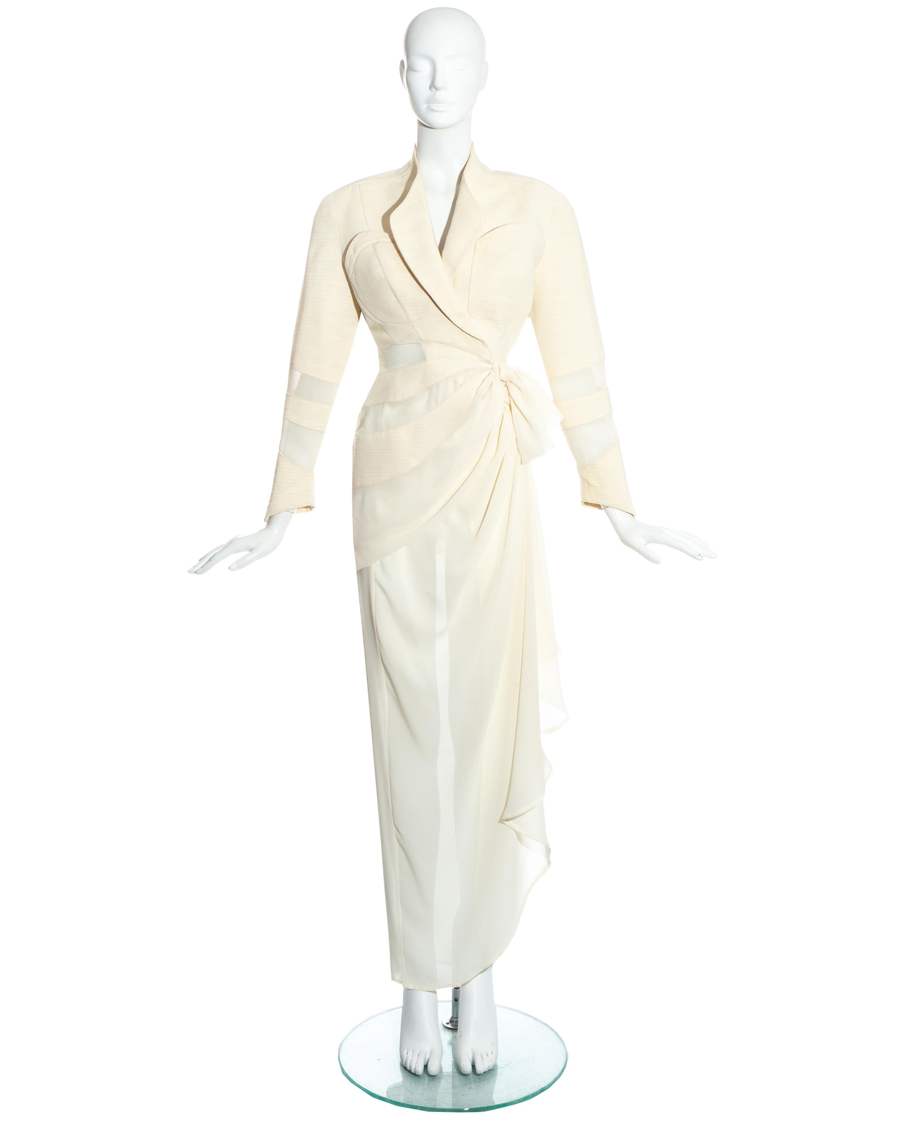 Thierry Mugler cream skirt suit. Blazer jacket with draped waist, sheer panels throughout and shoulder pads. Maxi draped wrap skirt with snap button fastenings.\

c. 19909s
