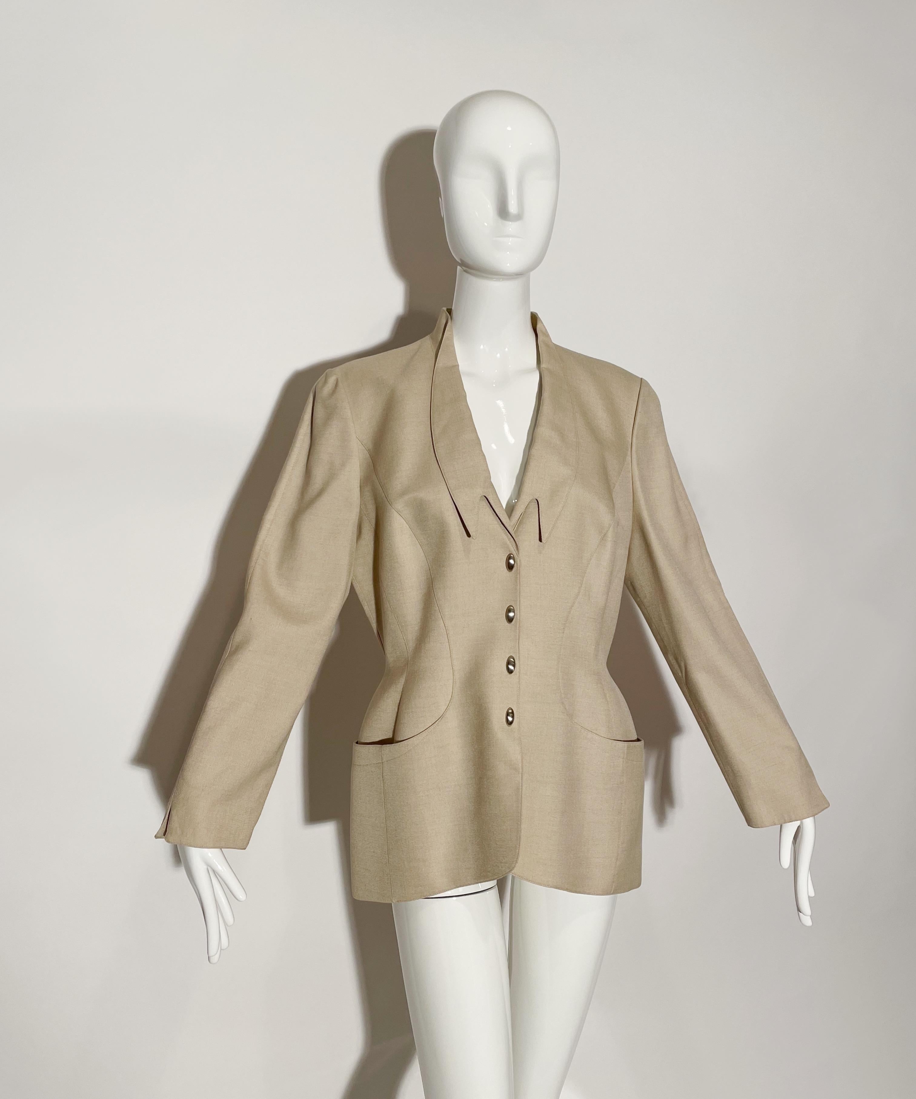 Structural creme blazer. Metal snap button closures. Deep front pockets. Single Breasted. Unique lapel. Lined. Viscose, rayon, and linen. Made in France.

*Condition: excellent vintage condition. No visible flaws.

Measurements Taken Laying Flat