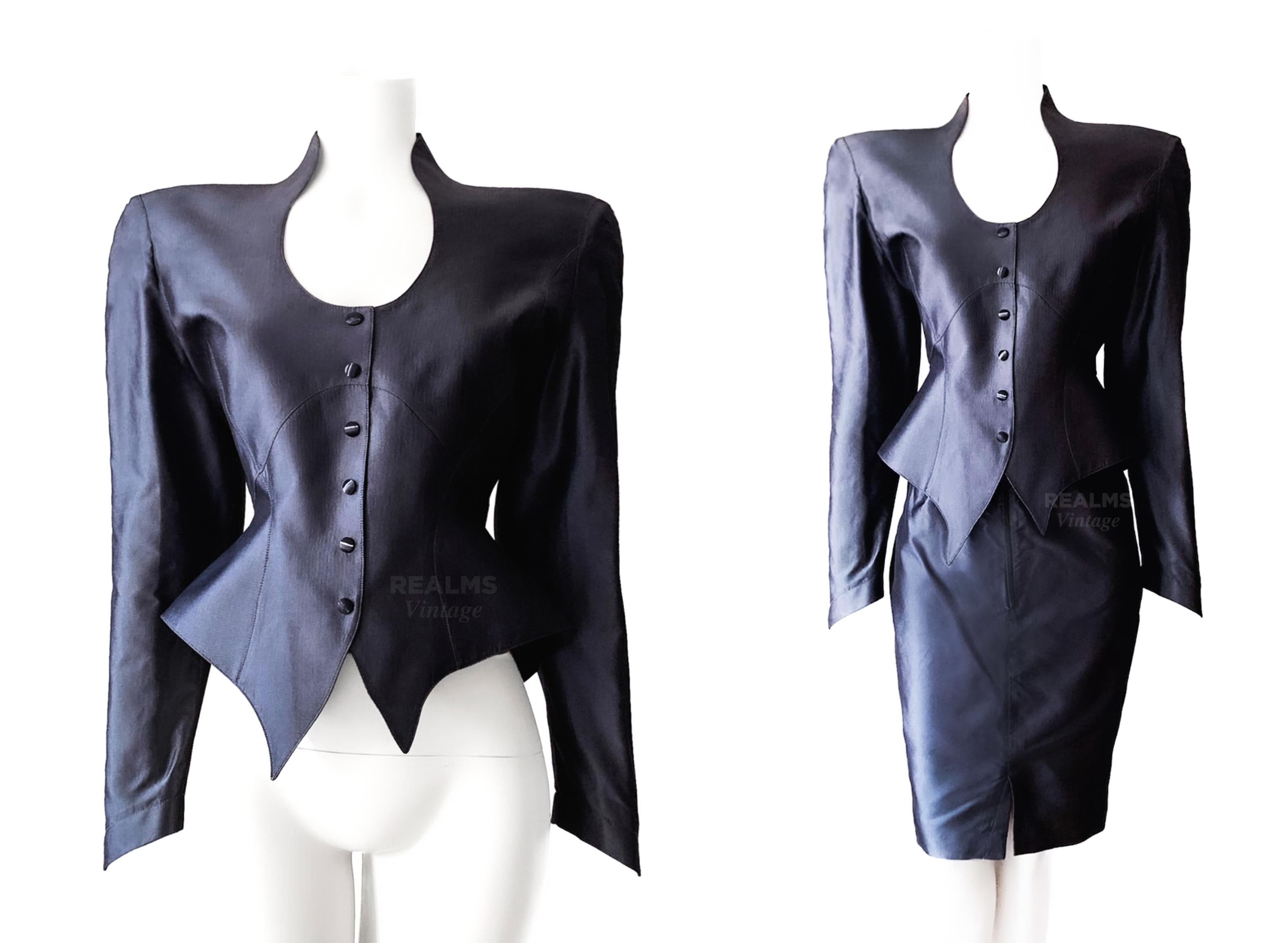 
The most stunning pure silk Thierry Mugler ensemble. Sooo Mugleresque! The combination of extraordinary avant-garde shape: pointy asymmetric hem and fitted horglass silhouette & luxurious elegance in high quality silk material.

Pure Silk Vintage
