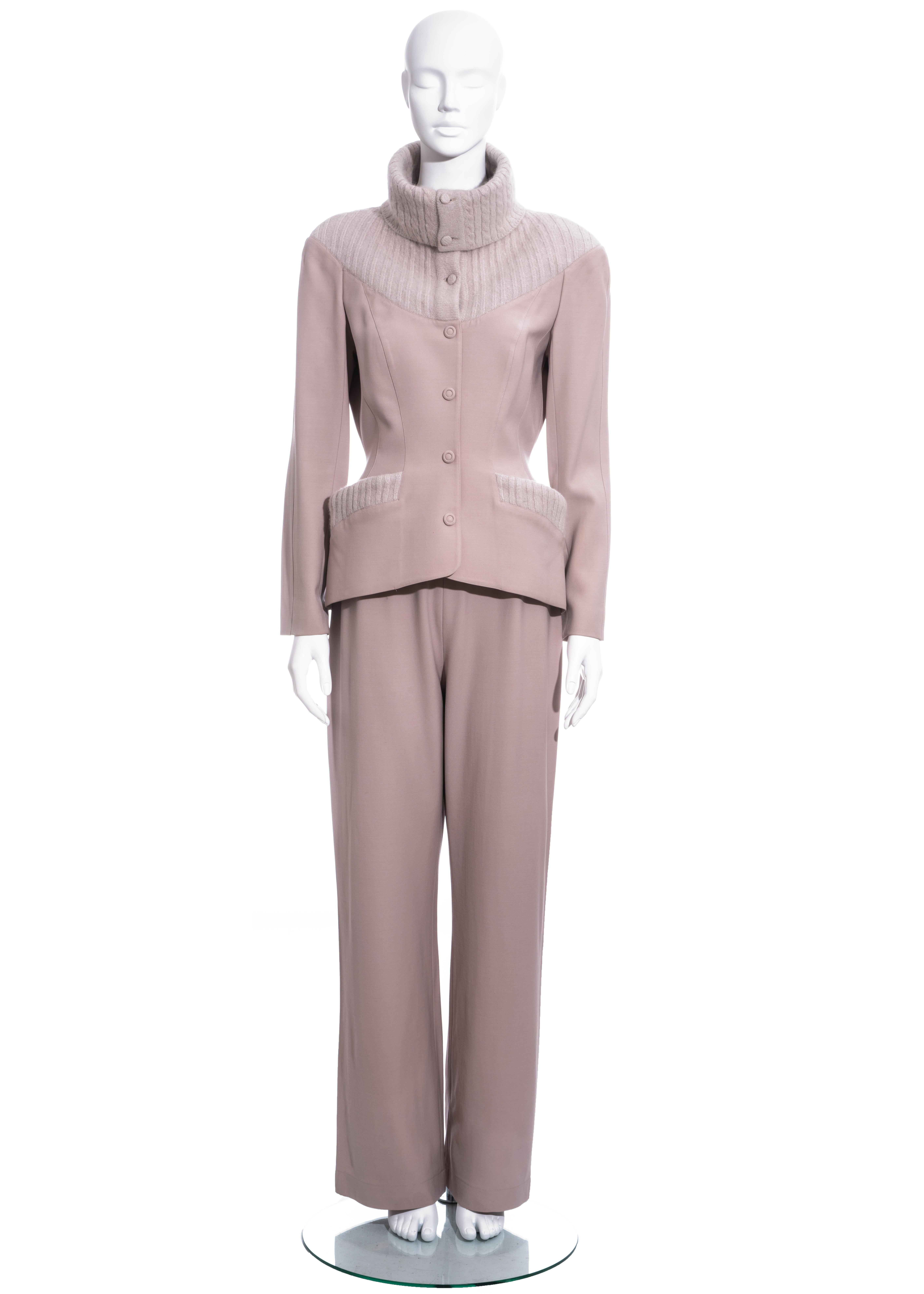 ▪ Thierry Mugler dusty pink pant suit
▪ 100% Wool
▪ Knitted turtle neck, yoke and trim
▪ Fabric cover buttons with hidden snap closure 
▪ Accentuated waist
▪ Straight-leg pants
▪ FR 42 - UK 14 - US 10
▪ Fall-Winter 1999