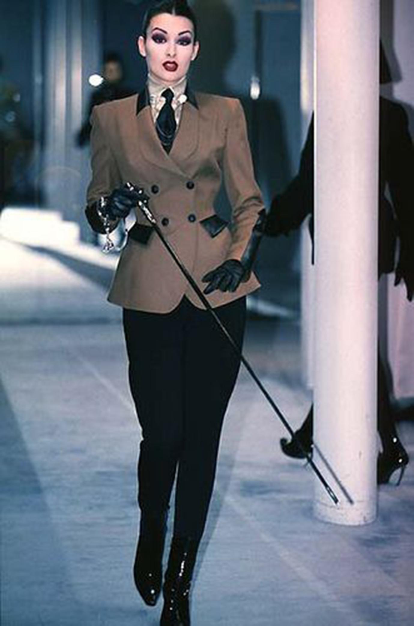 Thierry Mugler vintage Fall Winter 1996 runway “Corporate Class” equestrian style jacket 

Brand: Thierry Mugler
Designer: Thierry Mugler
Collection: Fall Winter 1996
Fabric: Wool, lined in rayon.
Color: Brown and Black
Size:  FR38 

Ultra rare