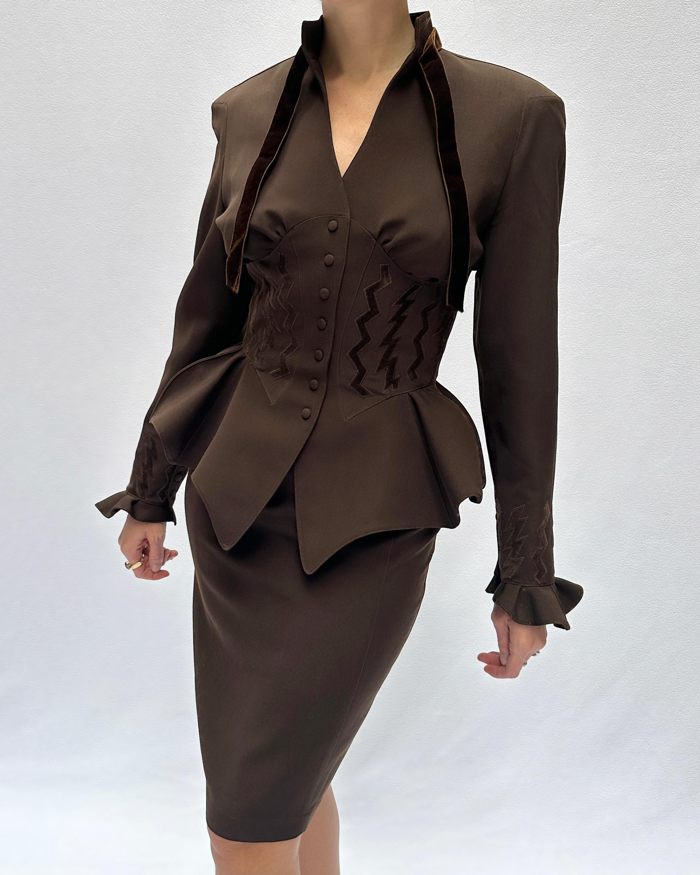 This Thierry Mugler skirt suit, from the Autumn 1992 couture collection, is a classic example of what made Mugler such a visionary of his era. It's a rare work of couture,  and a truly breathtaking collector's item, an especially iconic look from