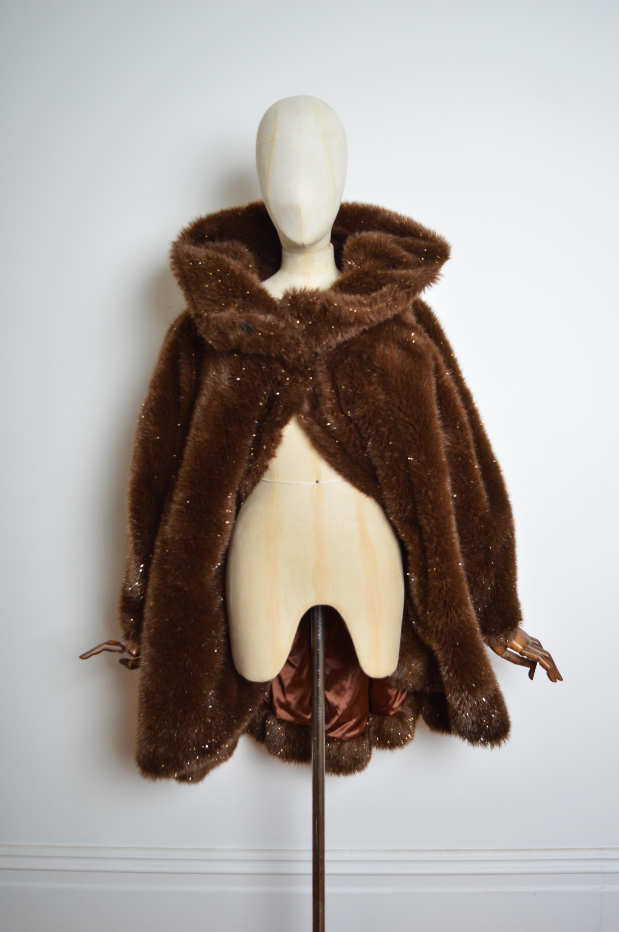 Thierry Mugler Fall 1997 Couture Faux Fur Brown & Gold Sparkly Coat.
Plush Brown & Gold Thick Faux fur Coat with Stole style exaggerated collar line and farrier hook closure, low slung Hip pockets, Chocolate brown satin rayon lining. 
MADE IN