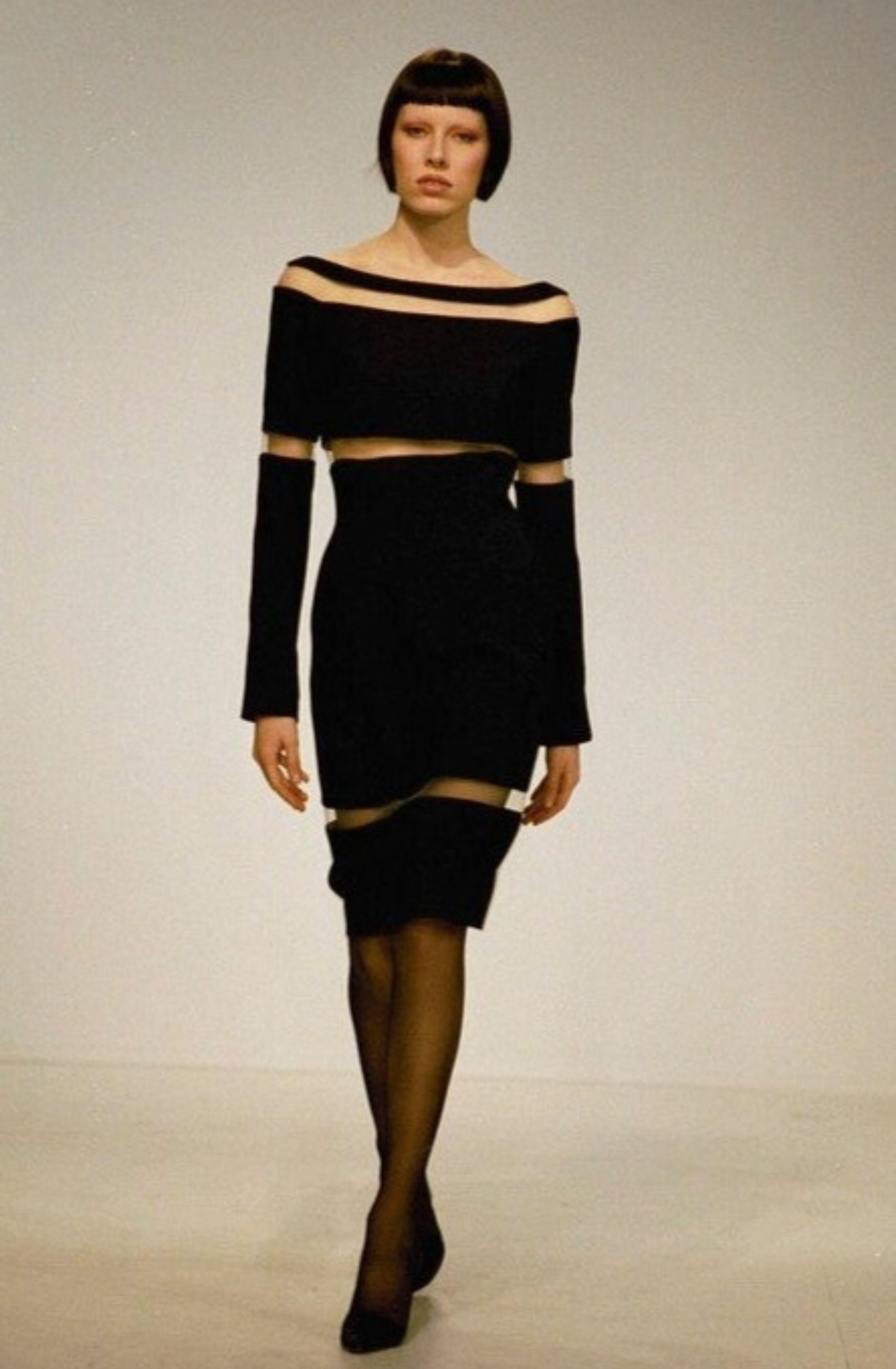 Vintage Thierry Mugler
Fall 1999 - seen on the runway
Black dress with sheer mesh panels
Long sleeve
Midi length
Zip up and popper button fastening up back

Size EU 38 / UK 10 / US 6

Measurements -
Bust 34