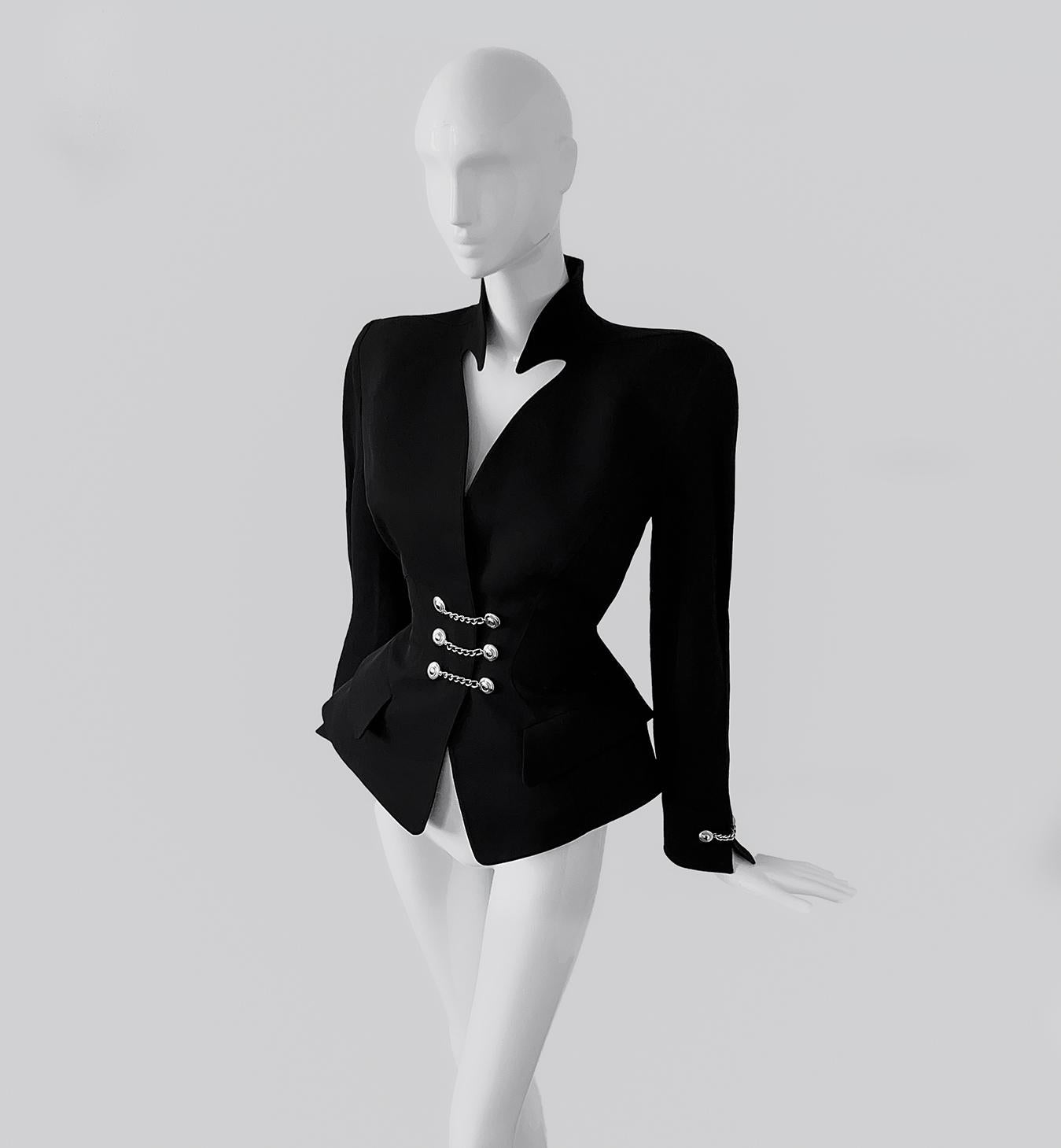 
Fabulous rare Thierry Mugler jacket, FW 1990s Collection.

This dramatic sculptural silhouette is truly spectacular. Extremely rare collectors' piece. Iconic Mugleresque hyper feminine shape with fitted waist and exaggerated hips.
Dramatic