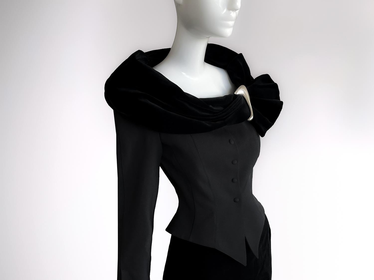 A Theatrical Masterpiece: Thierry Mugler FW 1992 in Black Wool and Velvet

Step into the world of high drama, where fashion meets architecture, and elegance collides with power! This breathtaking ensemble from Thierry Mugler's Fall/Winter 1992