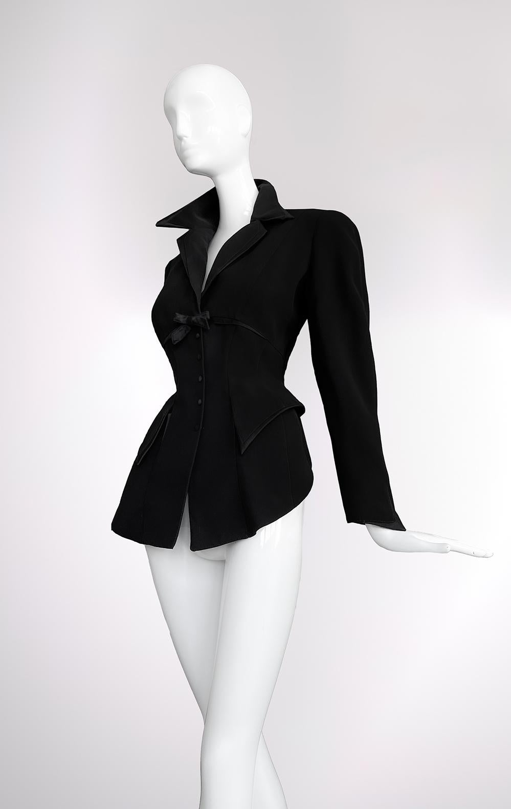 Few designers have mastered the art of sculpting the female form quite like Thierry Mugler, and this Fall/Winter 1995 jacket stands as a testament to his architectural genius. A symphony of structure and seduction, it embodies the couturier’s