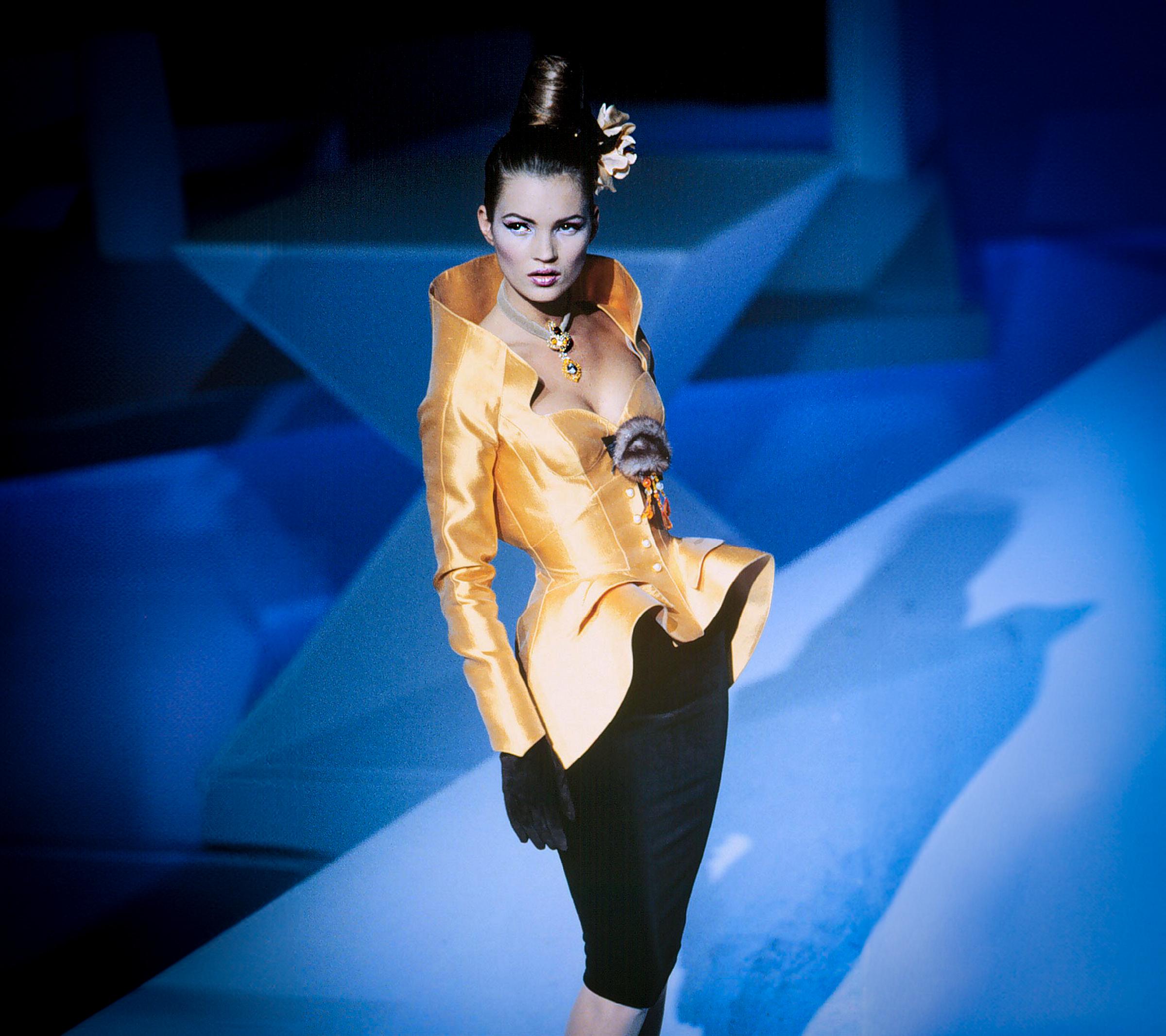 Extremely rare iconic Thierry Mugler Jacket from his legendary Fall/Winter 1995 Collection.
The sculptural showstopper piece exudes theatrical grandeur and sculptural artistry. 
Seen gracing the silhouette of Kate Moss, this jacket is a masterclass