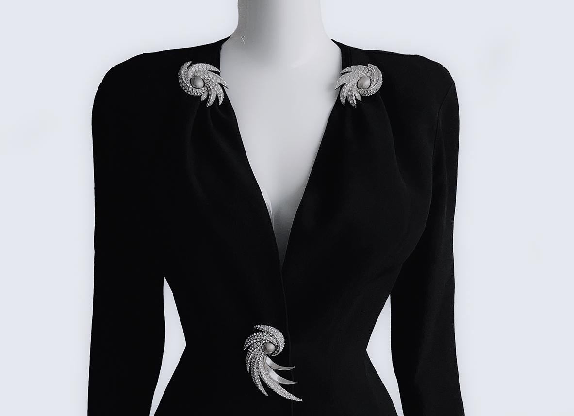 
Fabulous Thierry Mugler jacket with gorgeous big crystal jewel details. Theirry Mugler 1995 Cruise collection.
Dramatic black jacket with iconic Thierry Mugler tailoring. Beautiful feminine fitted shape, deep V-neck and dramatic