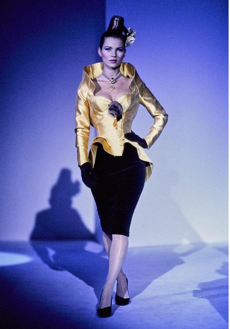 This fantastic sculptural gold jacket is a piece from one of the most iconic fashion shows; the 1995 FW Thierry Mugler Haute Couture show celebrating the 20 year existence of his label. The same model jacket was worn on the catwalk by Kate Moss. The