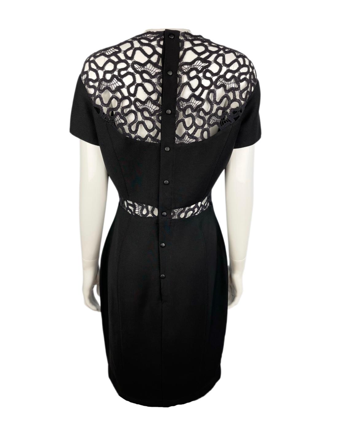Stunning Thierry Mugler 1990s black cocktail dress with gorgeous transparent lace top and down the bust details. 
Body hugging hourglass silhouette. Press stud  closure at the back. Slightly curved skirt hem on the front, which was an iconic Mugler