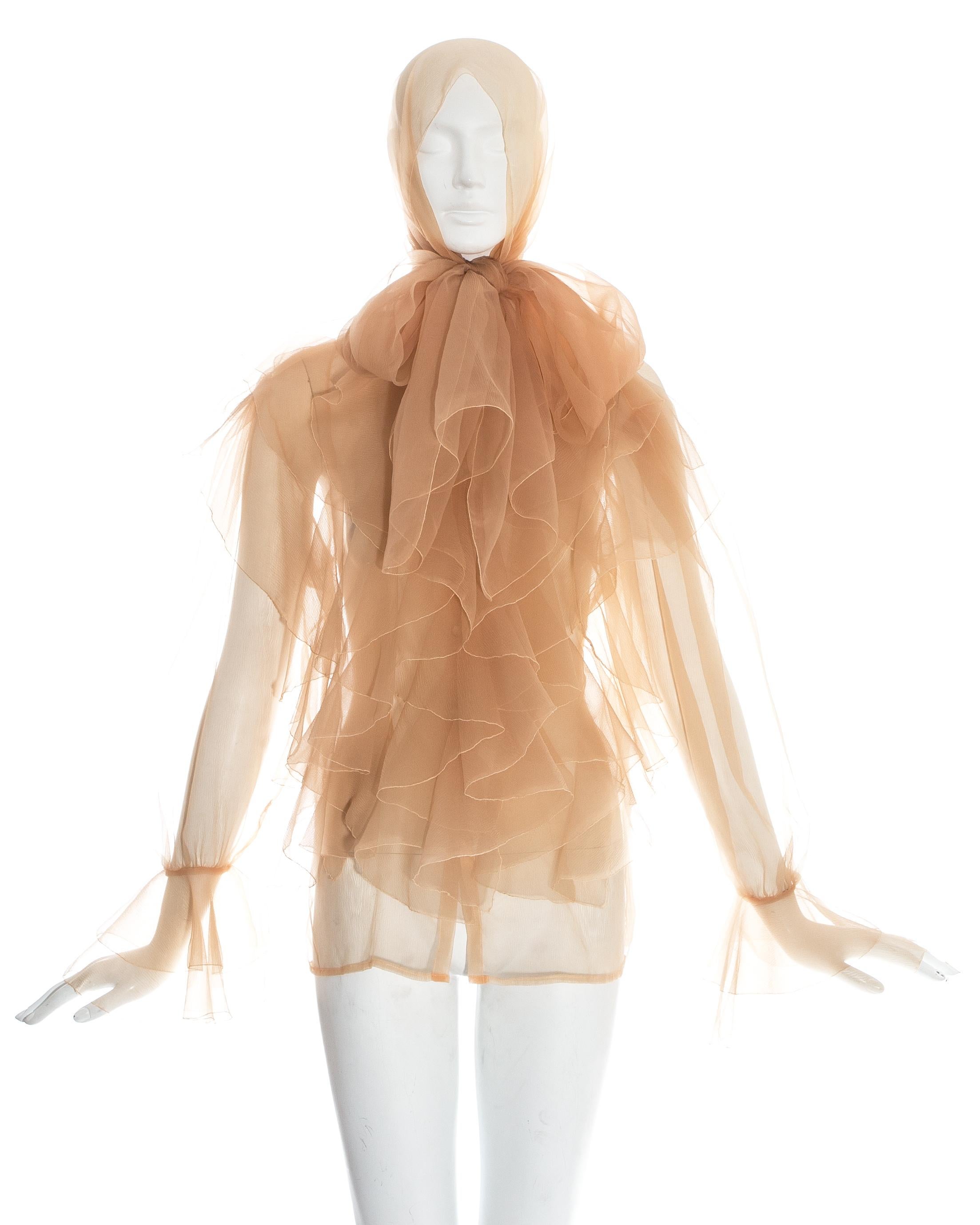 Thierry Mugler nude chiffon ruffled poet blouse with attached long scarf.

Spring-Summer 1982