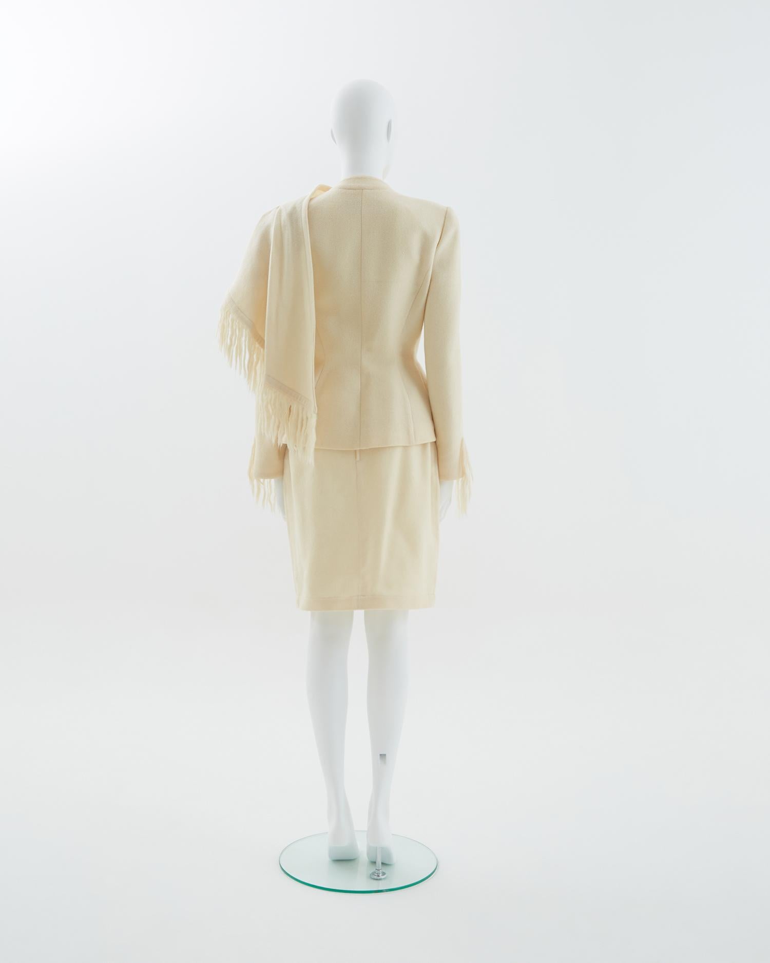 - Mohair off-white jacket with fringe scarf collar and cuffs detailing 
- Sold by Skof.Archive
- Fully lined and slightly padded shoulders
- Clasp fastenings at the front 
- Snap closure at the side 
- Fitted silhouettes 
- 1990s period

Size
FR 40
