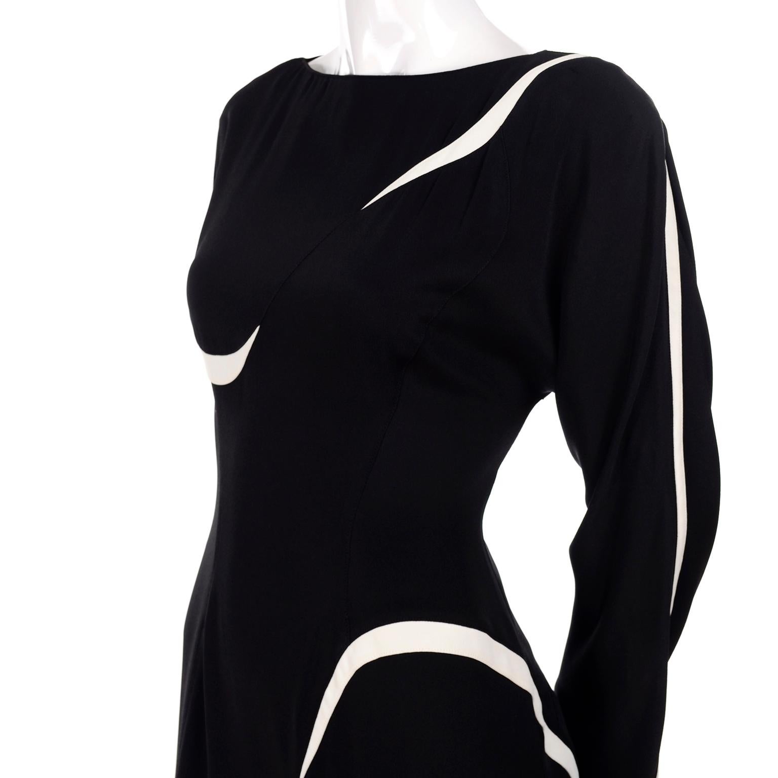 This is a sensational black and white Jumpsuit from Thierry Mugler.  We fell in love with this piece when we found it and it is easy to see why!  This incredible 1 piece jumpsuit is in a black stretch knit with slashes of white throughout.  The