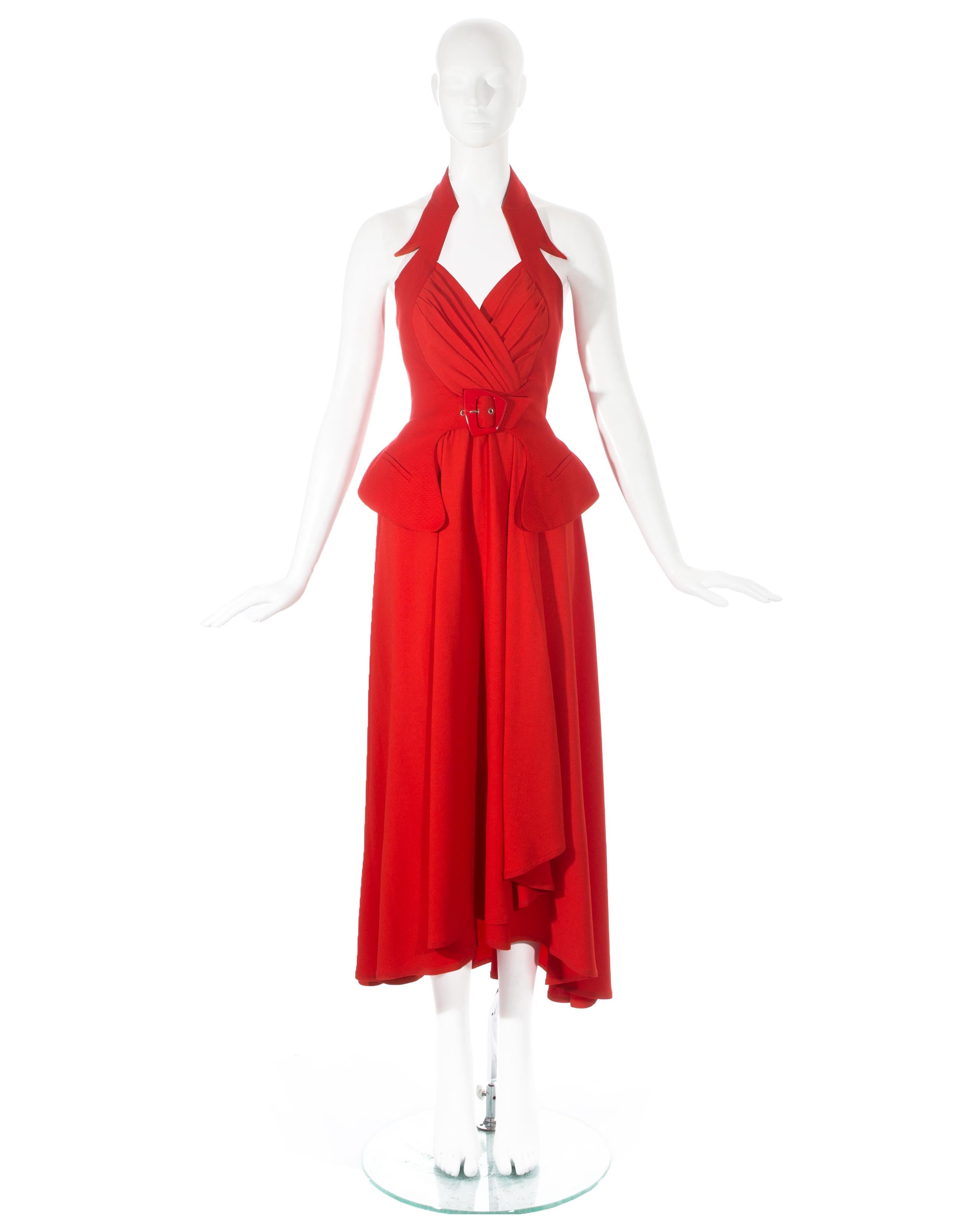 Thierry Mugler; red crepe halter-neck wrap dress with matelasse cotton over-bodice with angular buckle to waist. 

Spring-Summer 1992