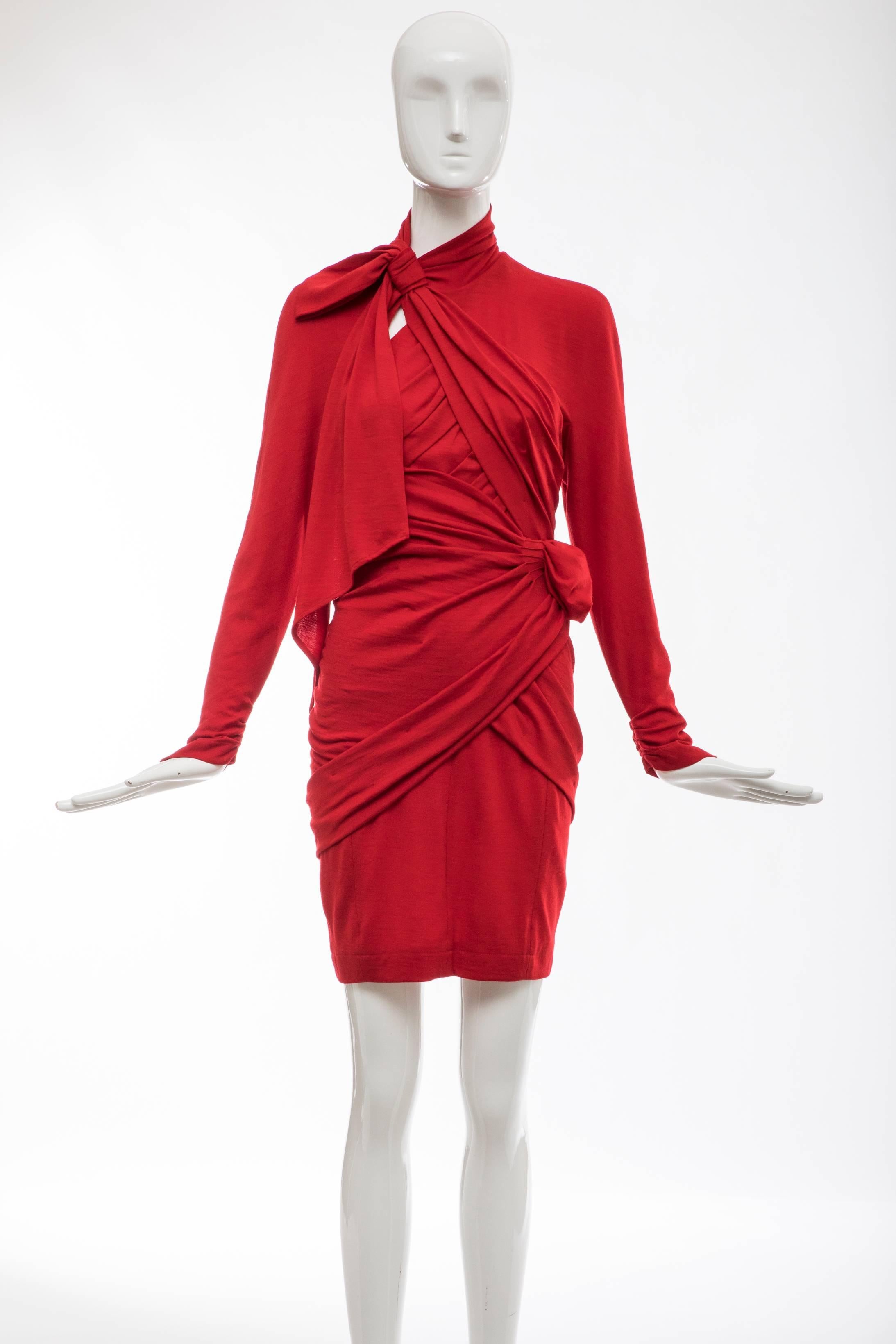 Thierry Mugler, Circa 1980's red wool jersey ruched dress with red satin built-in-corset, zip hook-and eye and snap back closure with snap high neck. 

EU. 36

Bust 28, Waist 24, Hips 32, Length 35