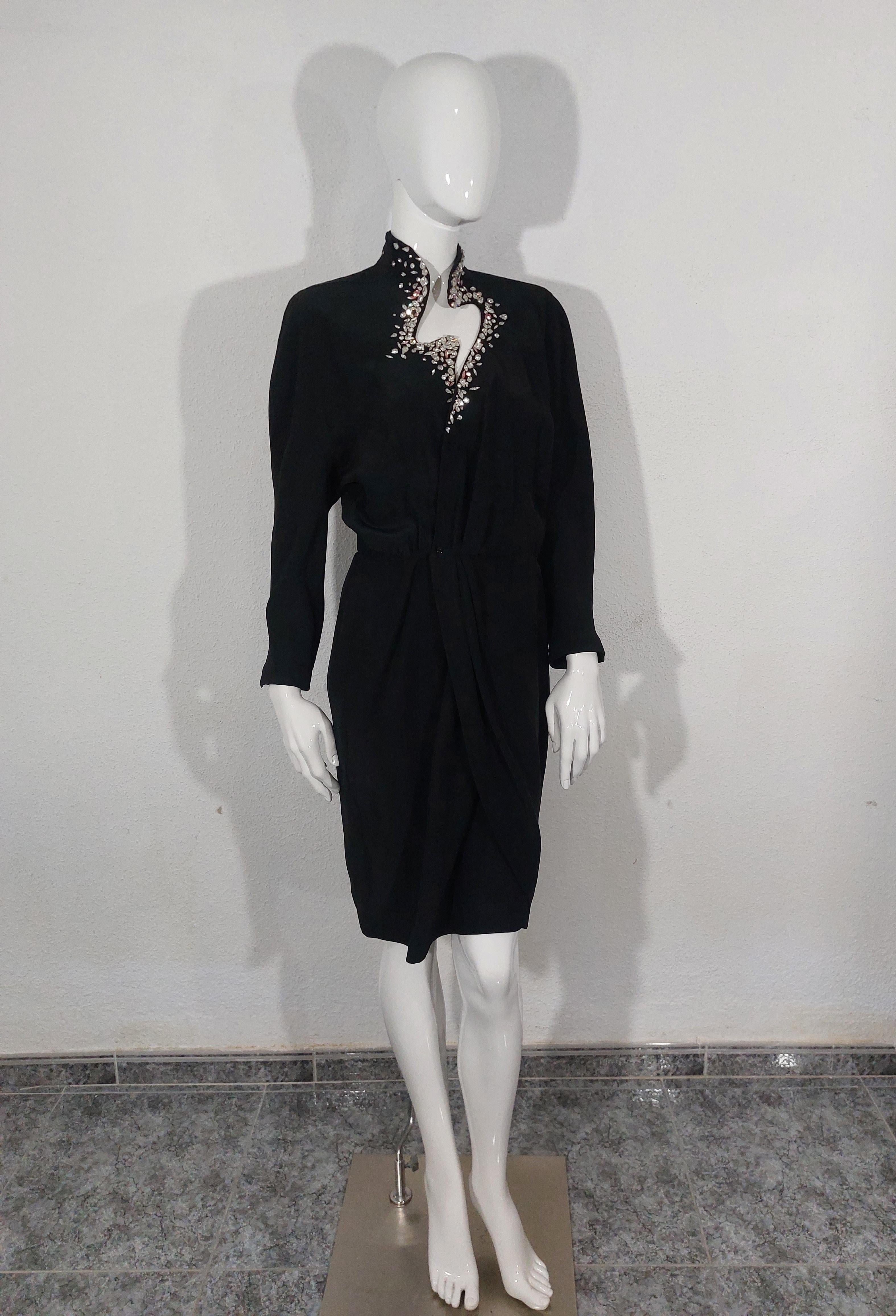 Thierry Mugler 1990s Wrap Rhinestone Crytal Stone Diamond Cutout Couture Evening  Cocktail Bee Black Vintage Paris France Dress Gown

Always with an eye toward the unexpected, Thierry Mugler created this black wrap cocktail dress with a striking