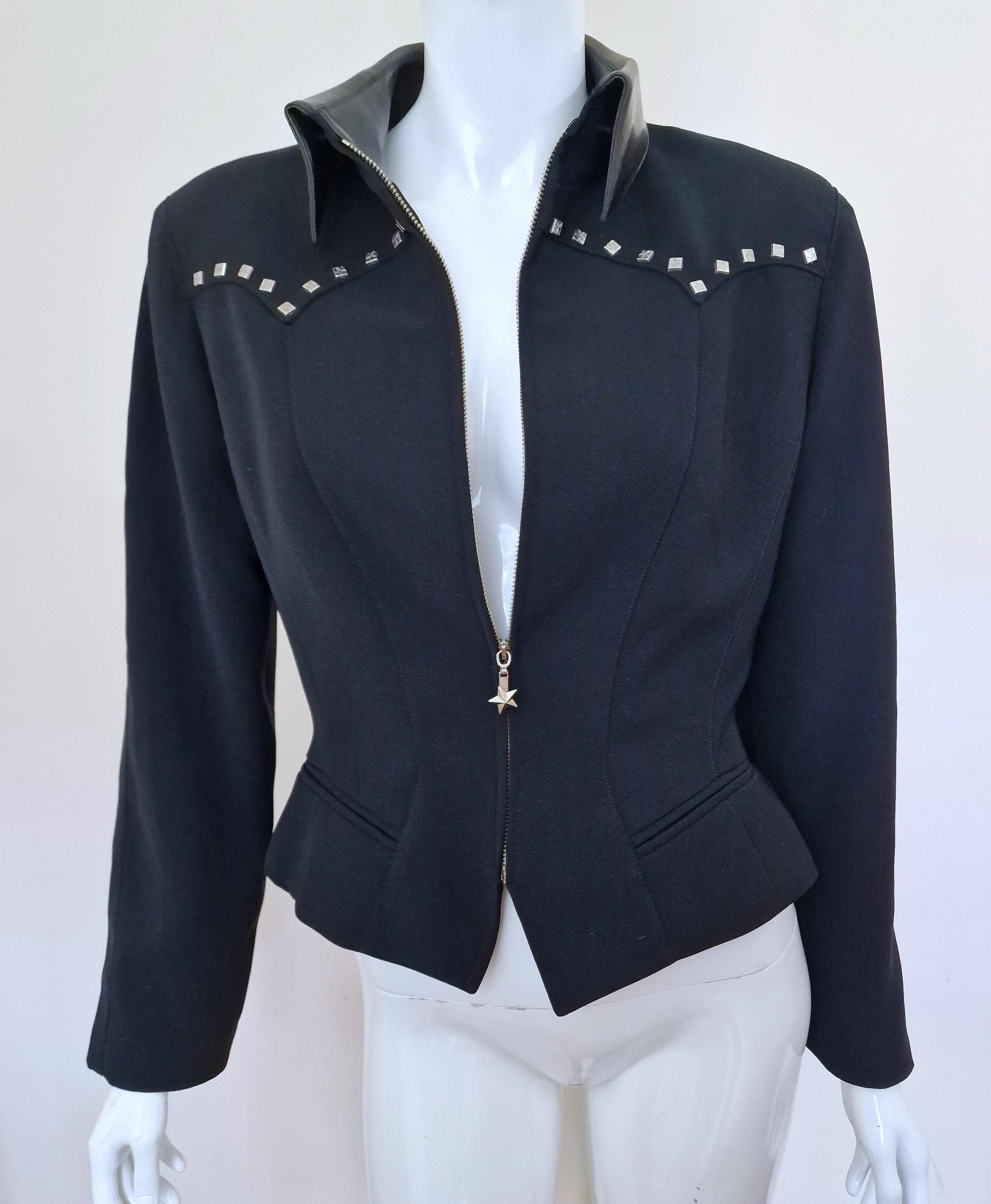 Beautiful piece by Thierry Mugler!
With shoulder pads!
Wonderful silhouette!
Wasp Waist look.
Metal star zipper and rivets! 
Faux lather collar!
Made in France!

EXCELLENT Condition!

SIZE
Fits from Medium to Large.
Marked size: FR42.
Length: 50-55