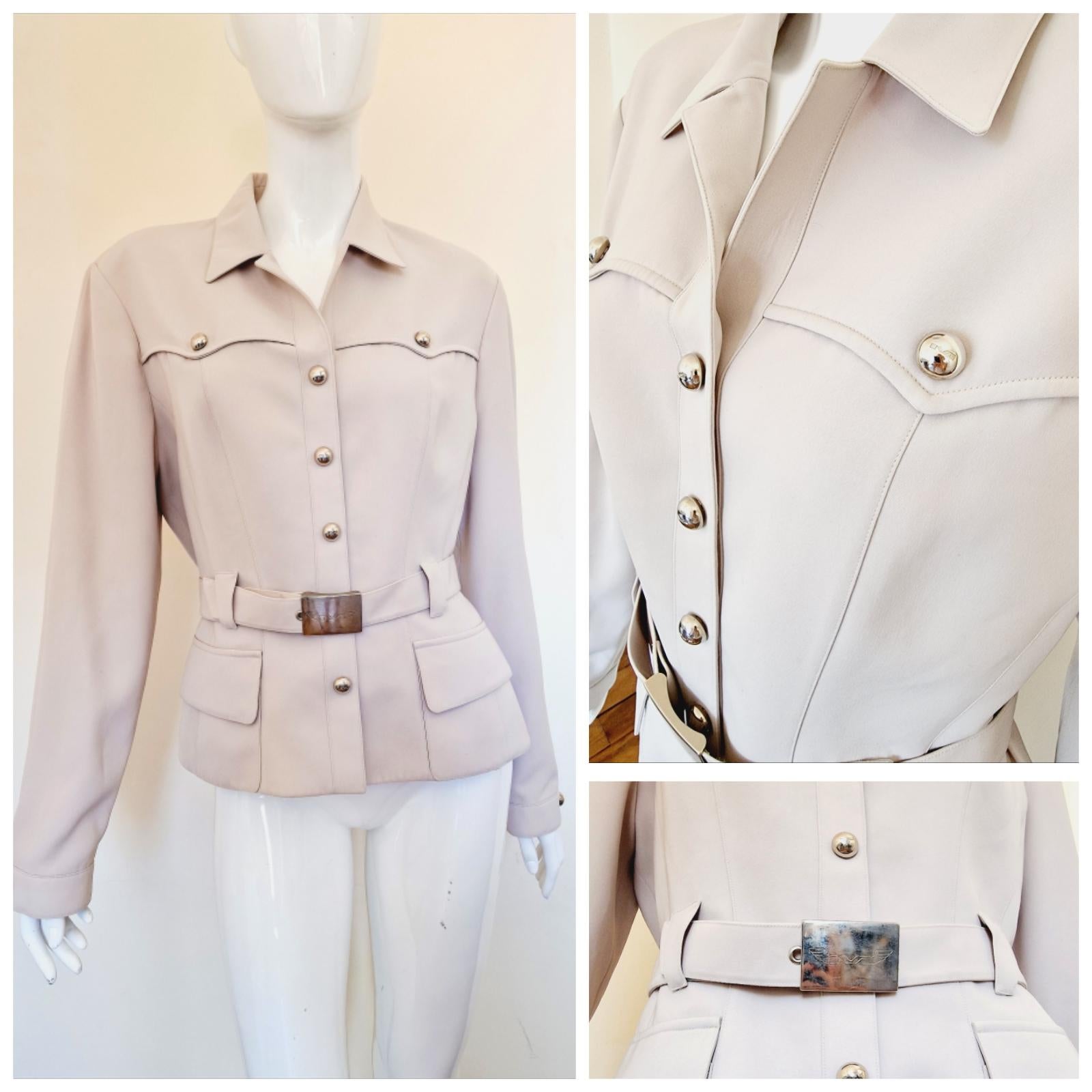 Beautiful piece by Thierry Mugler!
with shoulder pads!
Wonderful silhouette!
Wasp Waist look.
MUGLER metal belt!
Saharan stlye!

VERY GOOD Condition.

SIZE
Medium.
No size label. 
Length: 59 cm / 23.2 inch
Armpit to armpit: 45 cm / 17.7 inch
Waist:
