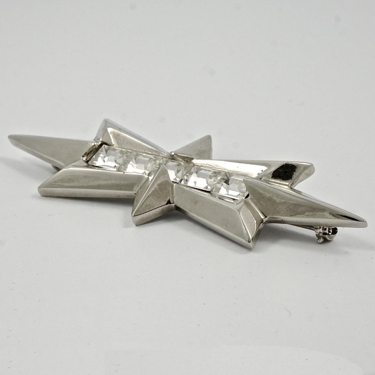 Beautiful Thierry Mugler silver tone star brooch, featuring four lovely emerald cut rhinestones. Measuring length 9.1cm / 3.6 inches by width 2.8cm / 1.1 inch. The brooch is in very good condition.

This is a wonderful star statement brooch by