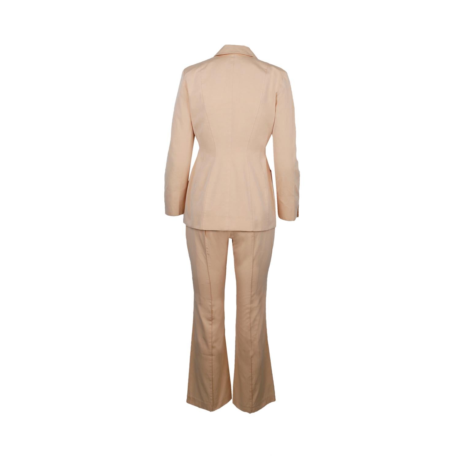 Thierry Mugler pink tailleur featuring slim fitting double-breasted jacket, long sleeves, button fastening, front pockets and flared trousers.

Total length - 71.5
Bust - 42.5
Waist - 33
Hips - 46
Shoulder - 38.5
Sleeve - 58.5
