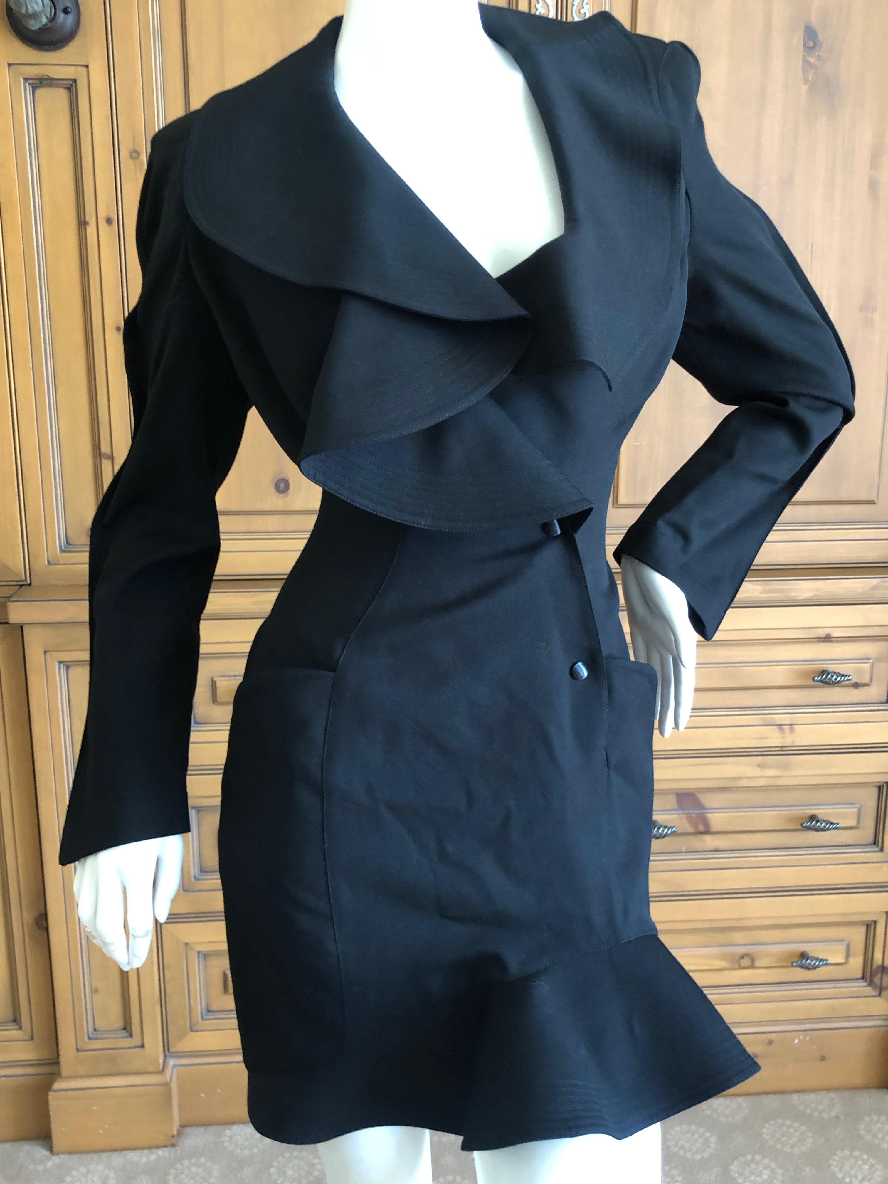 Thierry Mugler Vintage 1980's Black Dress with Exaggerated Ruffled Collar.
Wool.
Snaps closed inside
Classic Mugler
Marked size 38 but runs large, please check measurements
Bust 40