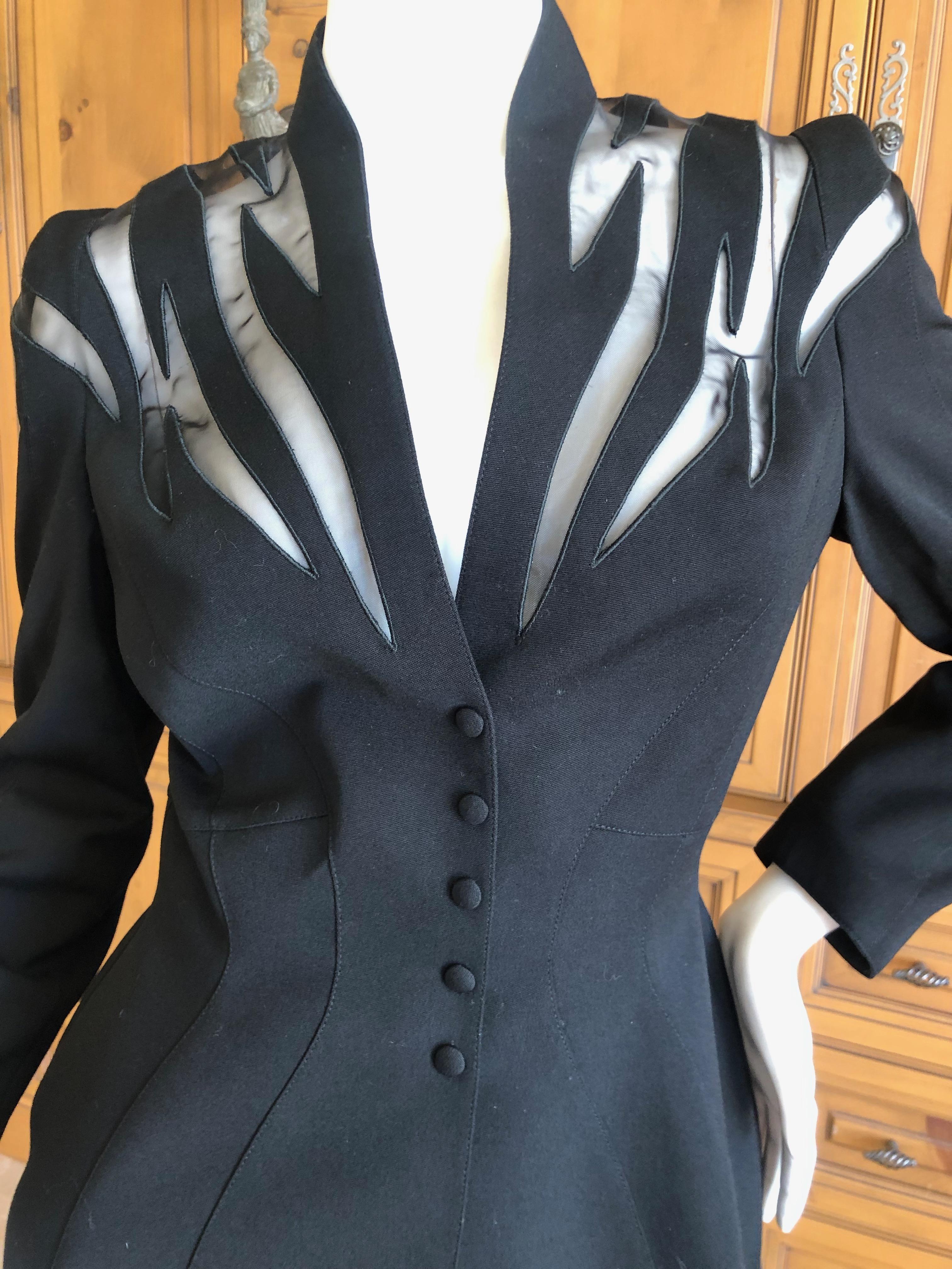 Thierry Mugler Vintage 1980's Black Peplum Suit with Sheer Flame Pattern Details
Size 38
 Classic Mugler 
Jacket
Bust 36