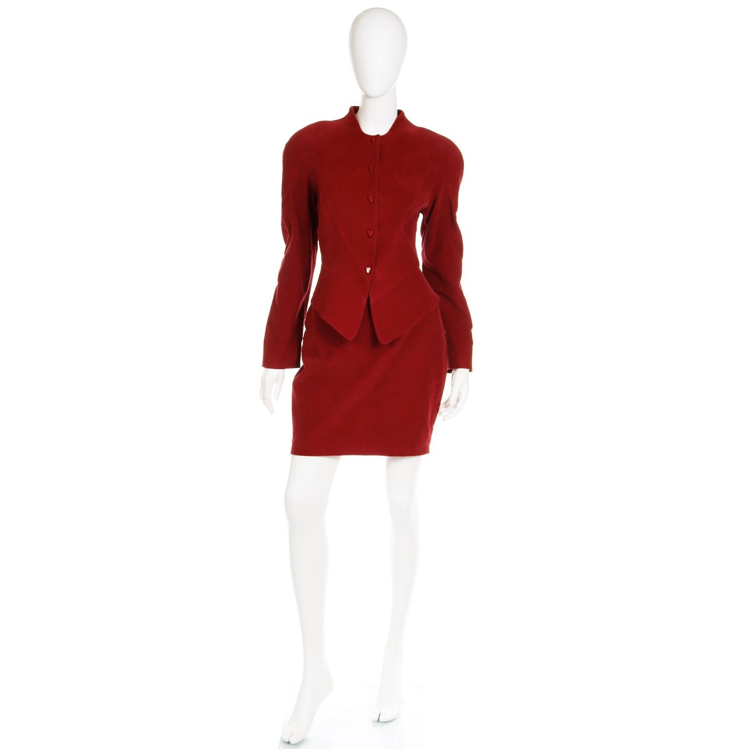 This is an unworn vintage Thierry Mugler Activ  late 1980's burgundy or dark brick red skirt and jacket suit. This outfit is deadstock with its original tags attached and it is in a sueded cotton fabric has the luxe feel of ultra suede.

The
