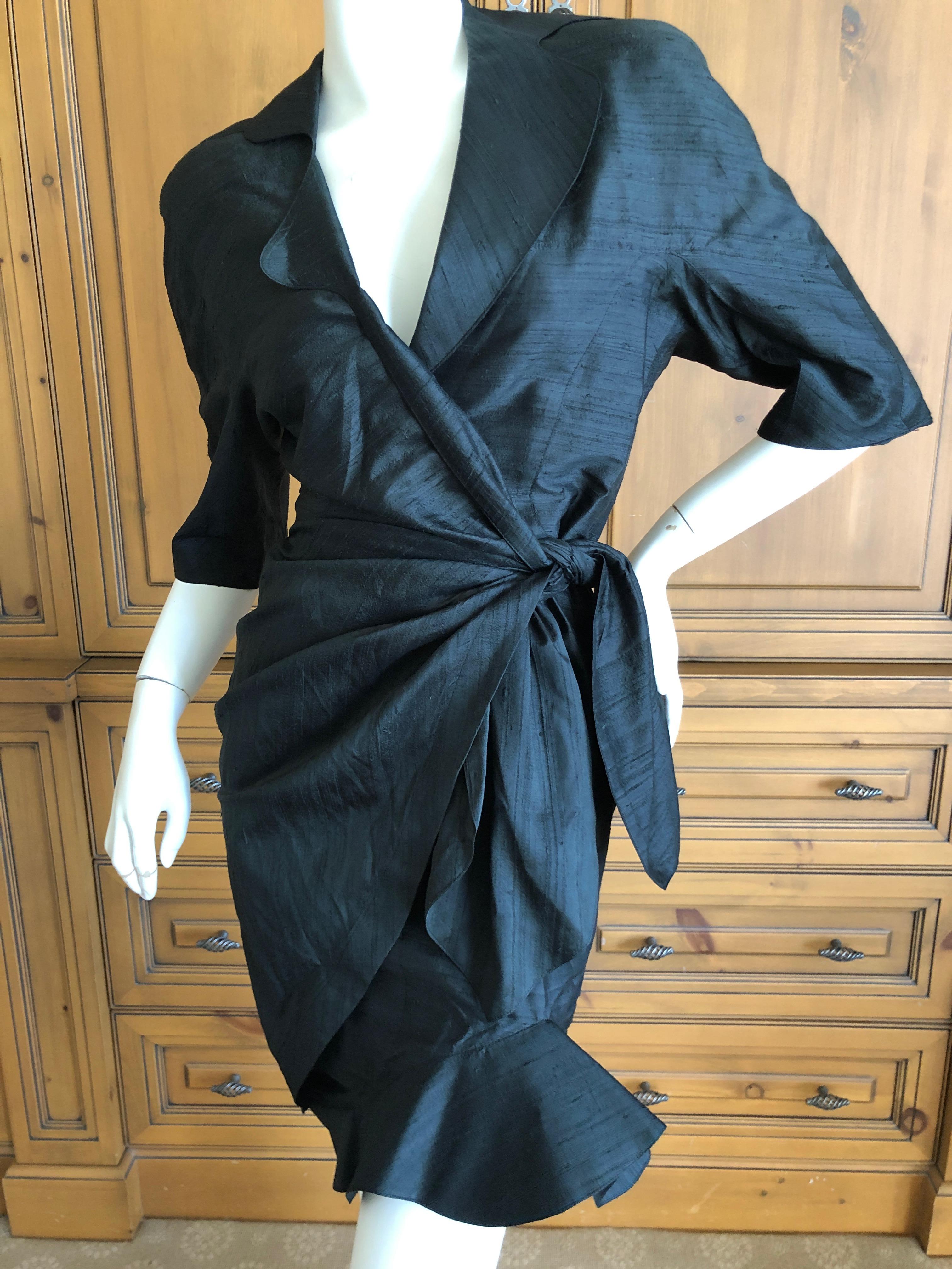 Thierry Mugler Vintage 1980's Dupioni Silk Little Black Dress.
Snaps closed inside, and then ties with two ties at the side
This is from the Thierry Mugler Fete collection, the fabric and size tag in Japanese only.
Classic Mugler
Bust 39