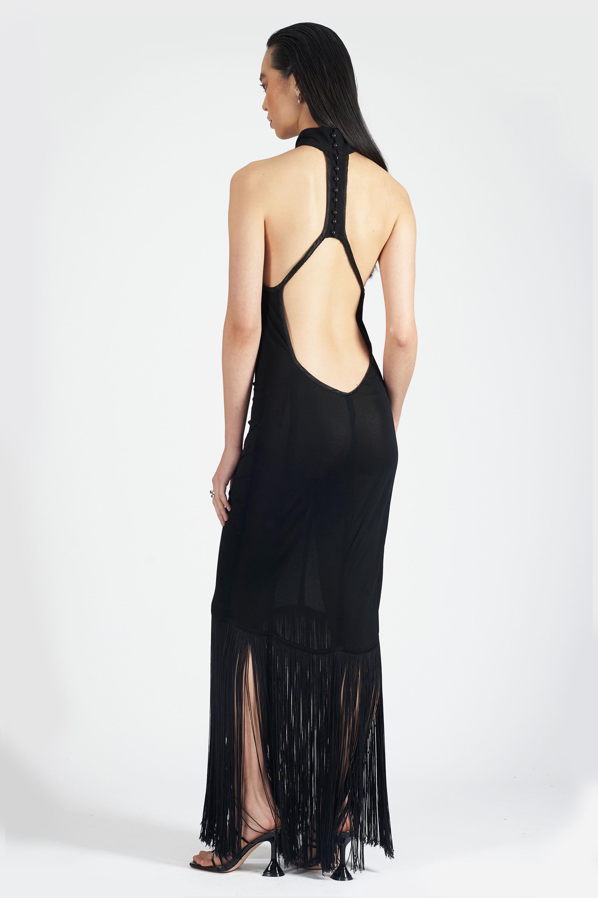Nordic Poetry are excited to present this rare Thierry Mugler 1980’s black halter neck maxi dress. Features halter neckline, fringe detail, low cut and open back. In excellent vintage condition. Authenticity guaranteed.

Label size: 42 FR
Modern