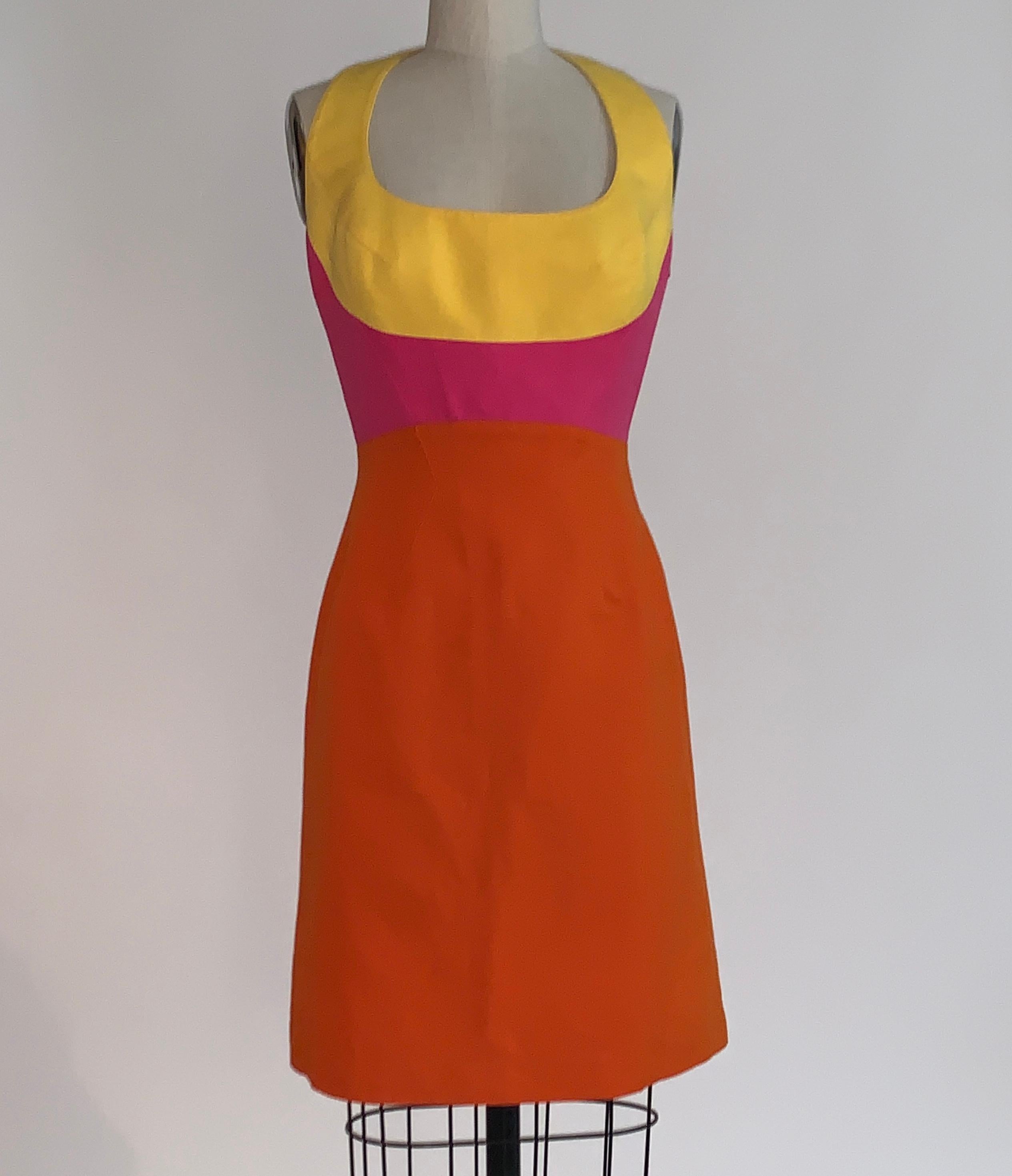 Thierry Mugler vintage 1990s color block pink, yellow, and orange dress with strap detailing at back from designer's Mugler line. Side zip, snap at back neck. 

60% cotton, 40% linen.
Fully lined in 100% acetate. 

Made in France.

Size FR 38,