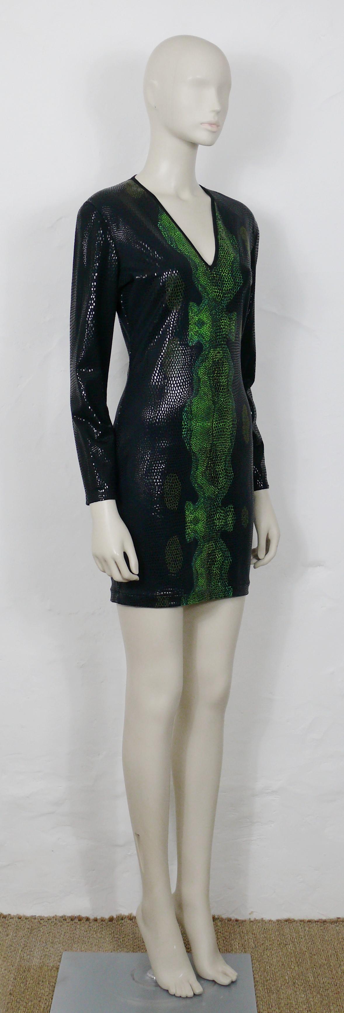 THIERRY MUGLER vintage black and green reptile skin like dress from the 1998 Autmn/Winter Collection.

This dress features :
- Stretchy fabric printed in spectacular glittering black and green reptile skin pattern. 
- Deep v-neck collar.
- Long