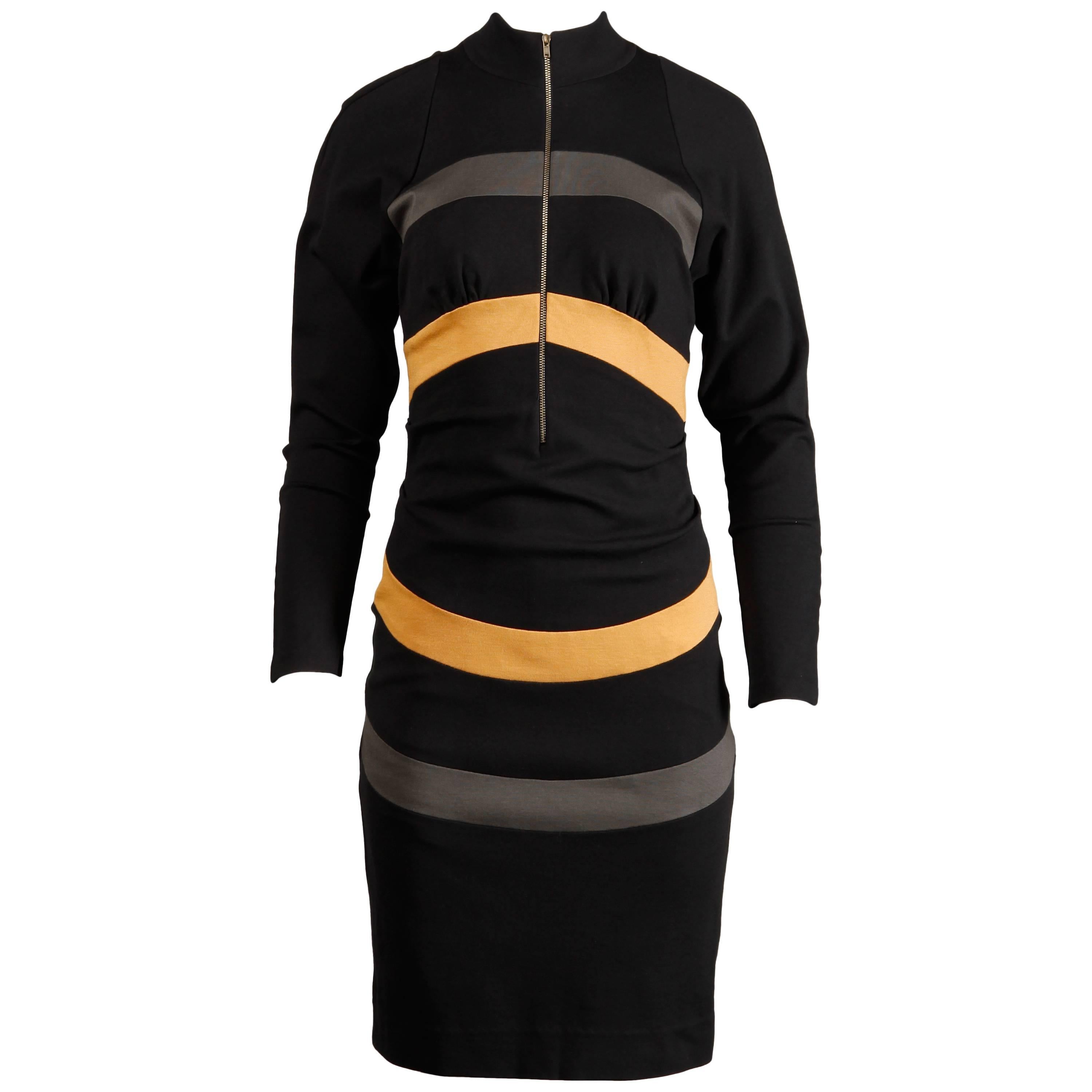 Avant garde circular striped dress by Thierry Mugler. Long sleeves and zip up front.

Details: 

Partially Lined
Front Metal Zip Closure
Marked Size: 40
Estimated Size: Small-Medium
Color: Black/ Grey/ Gold
Fabric: Jersey (Feels like Wool)
Label: