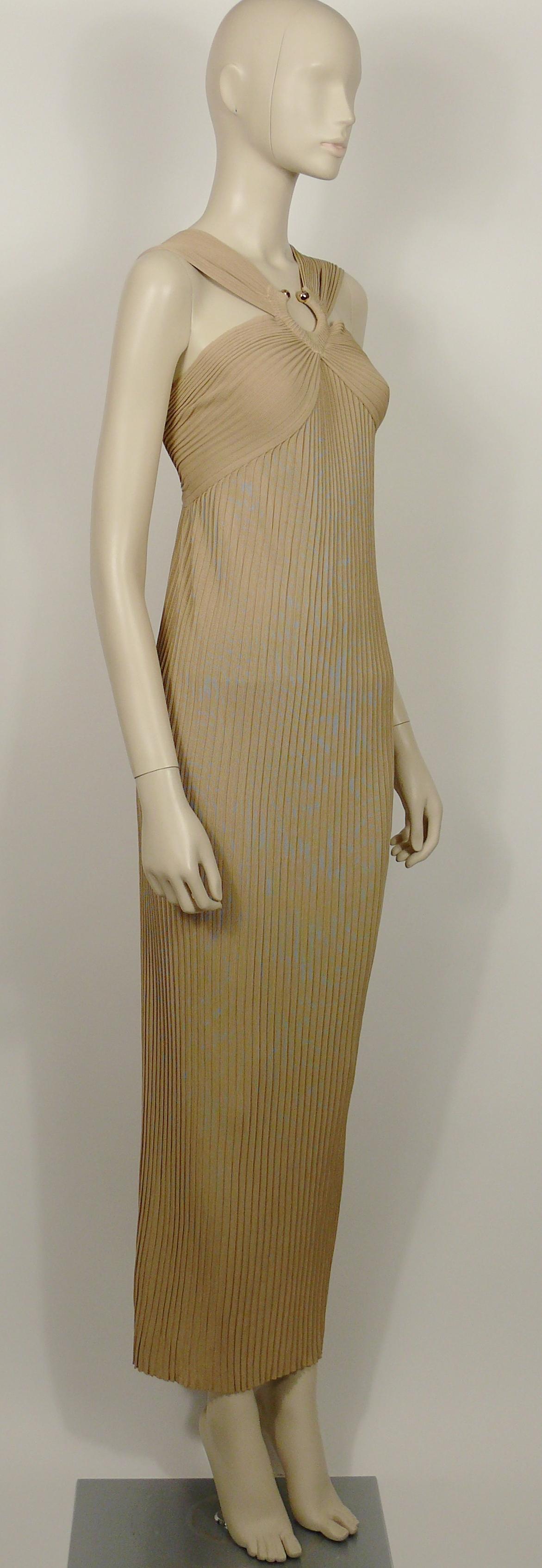 THIERRY MUGLER vintage beige viscose ribbed knit goddess dress embellished with an hammered gold toned ring detail.

Slips on.
Has stretch.
No lining.

Label reads THIERRY MUGLER Paris Made in Italy.

Size label reads : S.
Please refer to