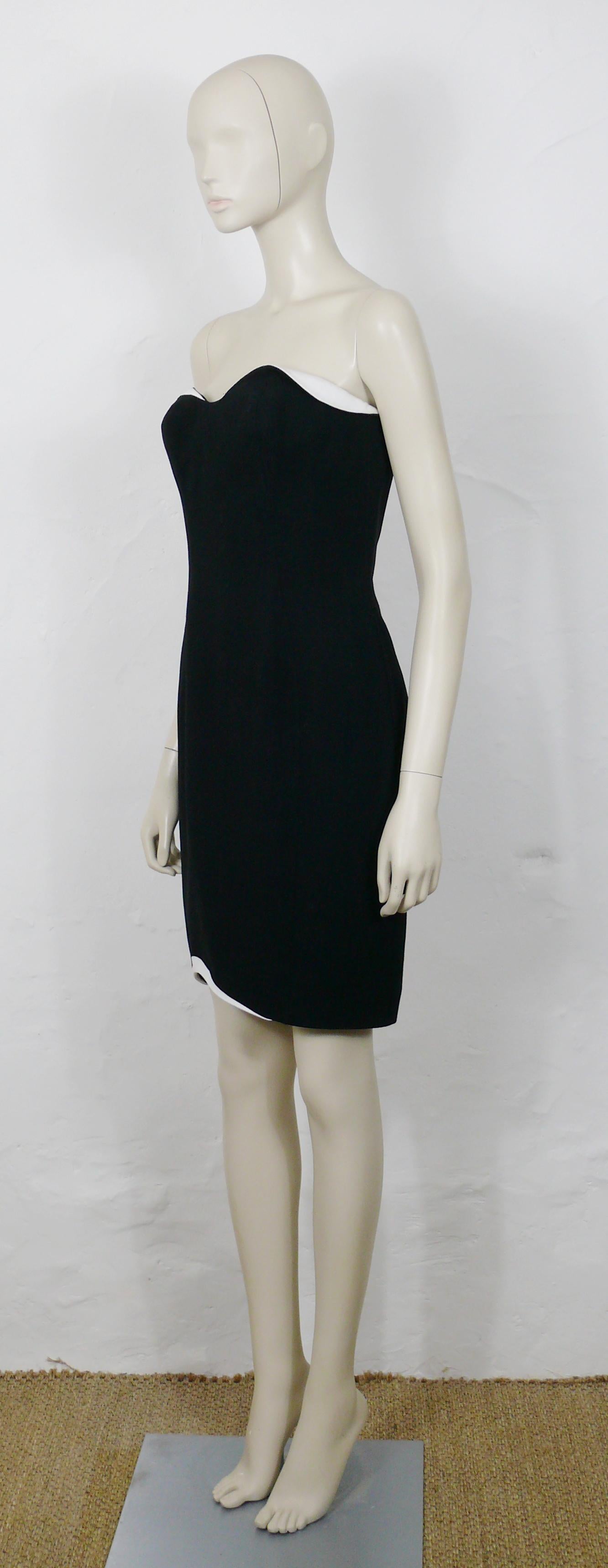 THIERRY MUGLER vintage black and white asymetric bustier dress.

This dress features :
- Black wool gabardine with asymetric white details on the bust line and the bottom edge.
- Structured bustier with boning.
- THIERRY MUGLER's typical sculptural