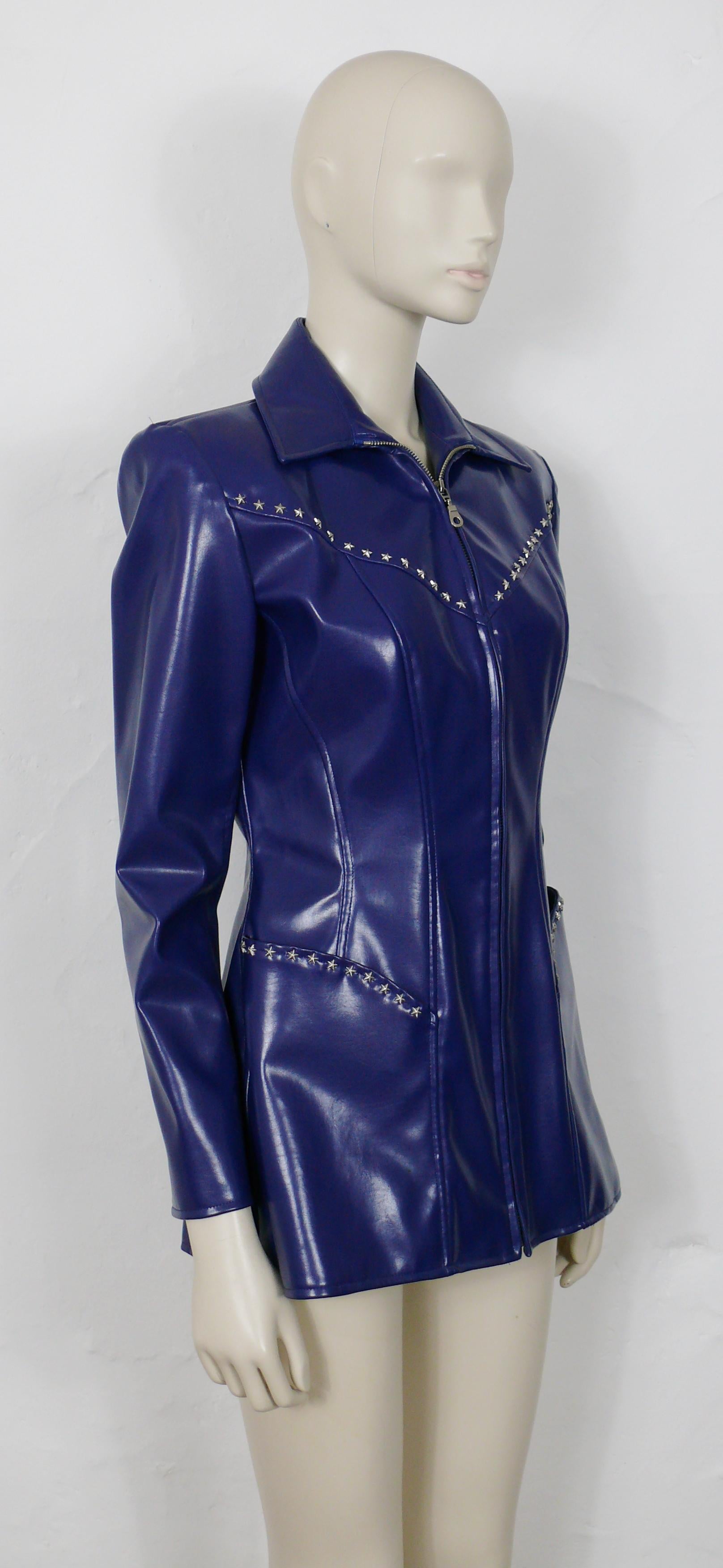 THIERRY MUGLER vintage blue rubber like jacket embellished with silver toned stars.

This jacket features :
- Soft blue rubber like fabric.
- Textured silver toned stars embellishement on bust and pockets.
- Classic collar.
- Long sleeves.
-