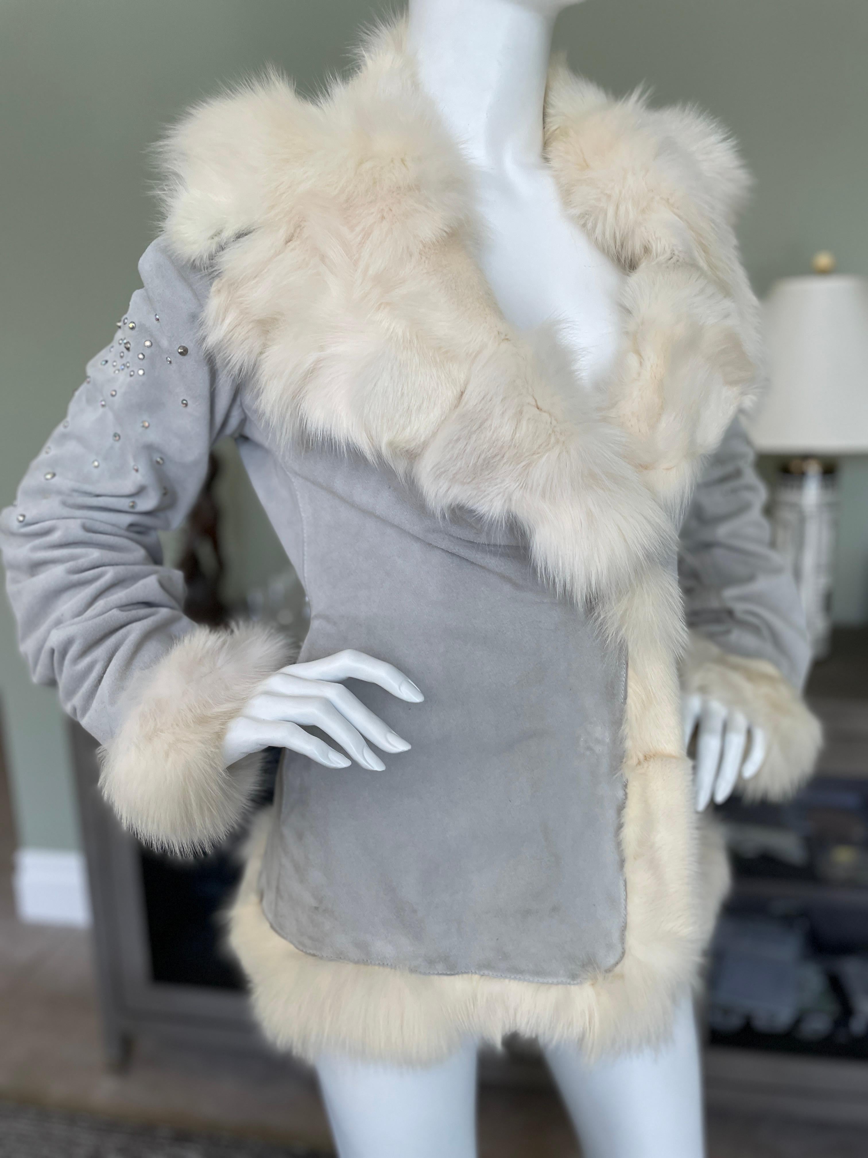 Thierry Mugler Vintage Suede Jacket with Fox Fur And Crystal Trim.
Pale blue suede with crystal accents on sleeves and fox fur trim.
Size 44
