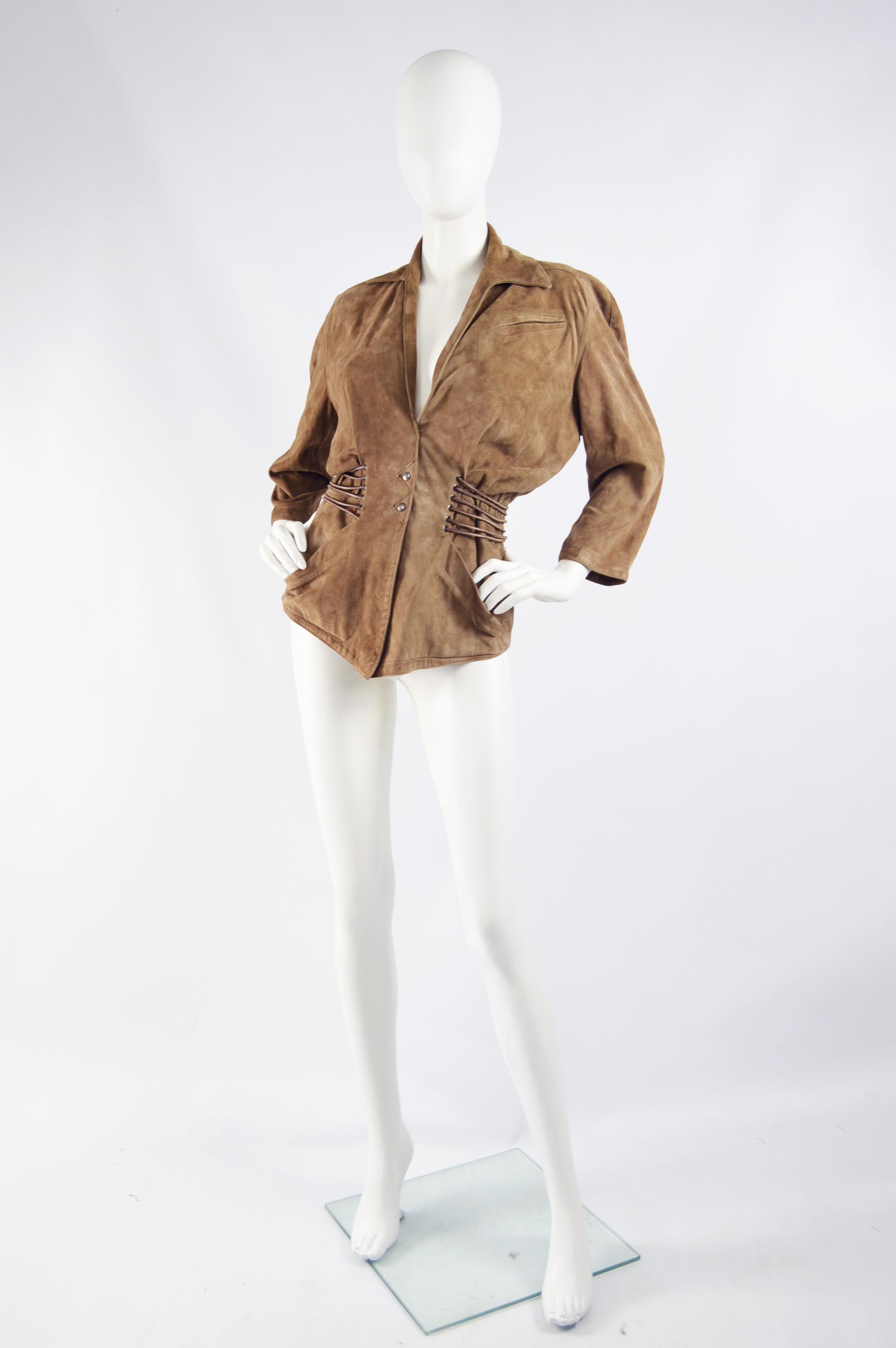 A rare and amazing vintage womens jacket from the 80s by Thierry Mugler. In a brown suede with a nipped waist and batwing sleeves. 

Size: Unlabelled; fits like a UK 6/ US 2/ EU 34. Please check measurements. 
Bust - 40” / 101cm
Underbust - 26” /