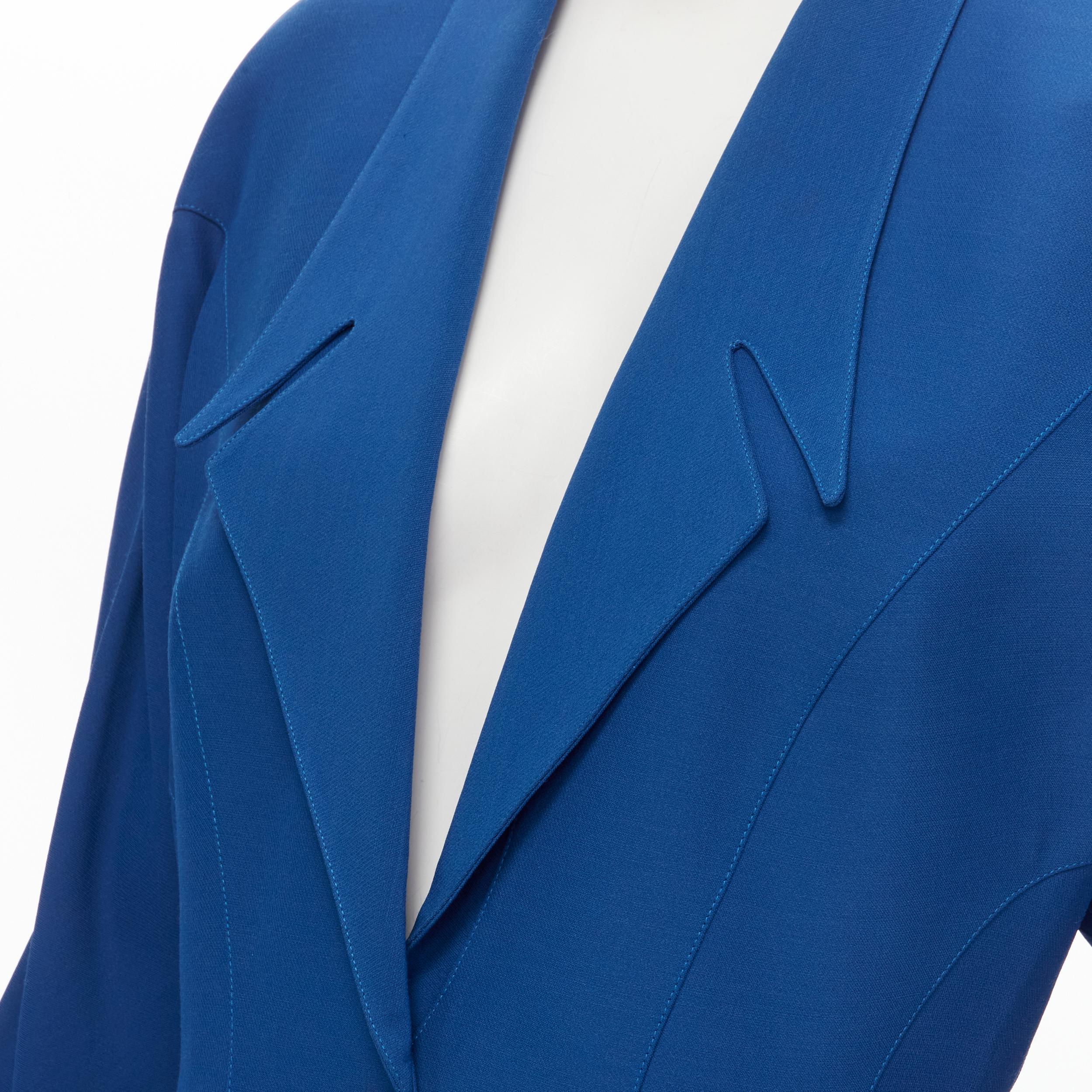 THIERRY MUGLER Vintage cobalt blue futuristic collar peplum jacket FR42 L 
Reference: GIYG/A00163 
Brand: Thierry Mugler 
Designer: Thierry Mugler 
Material: Viscose 
Color: Blue 
Pattern: Solid 
Closure: Snap 
Extra Detail: Futuristic notched