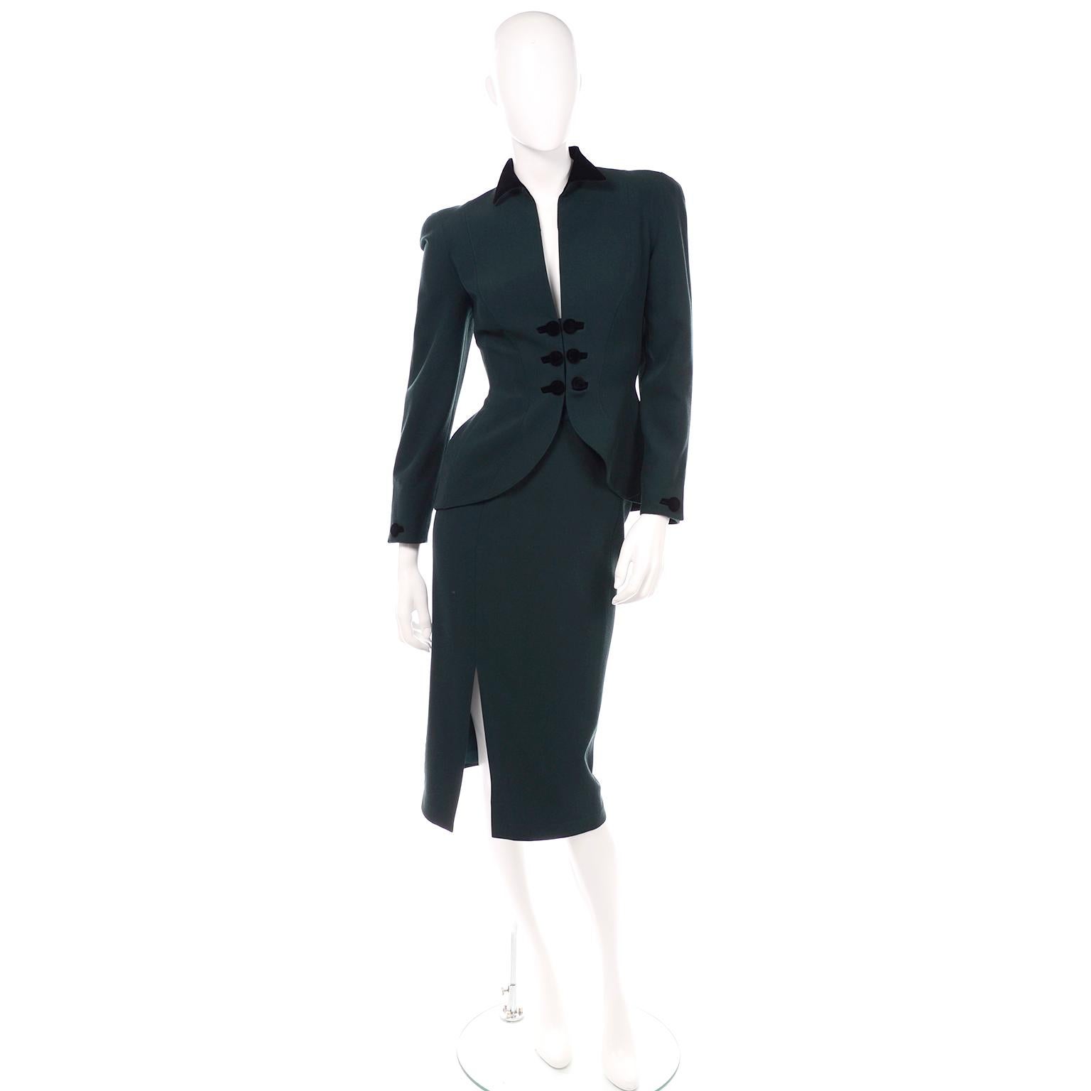 This vintage forest green wool Thierry Mugler 2 piece skirt suit is so spectacular! We love the front opening of the jacket with the double black velvet covered buttons and velvet lined pointed collar. This suit is a signature Mugler shape and