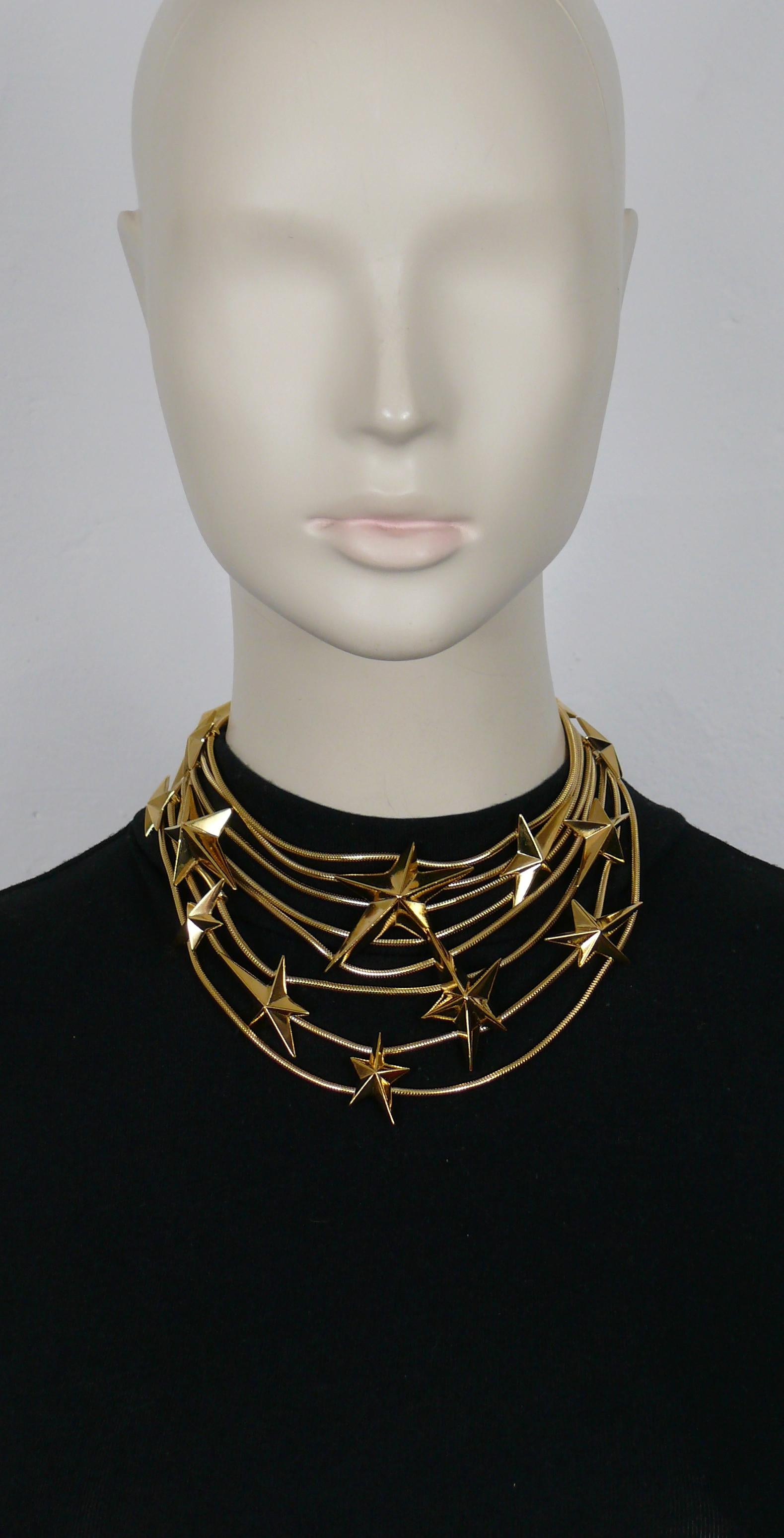 THIERRY MUGLER vintage rare gold tone multi strand snake chains choker necklace embellished with THIERRY MUGLER's iconic stars.

From a French private collection.

Adjustable T-bar and toggle closure.

Embossed THIERRY MUGLER and TM.

Indicative