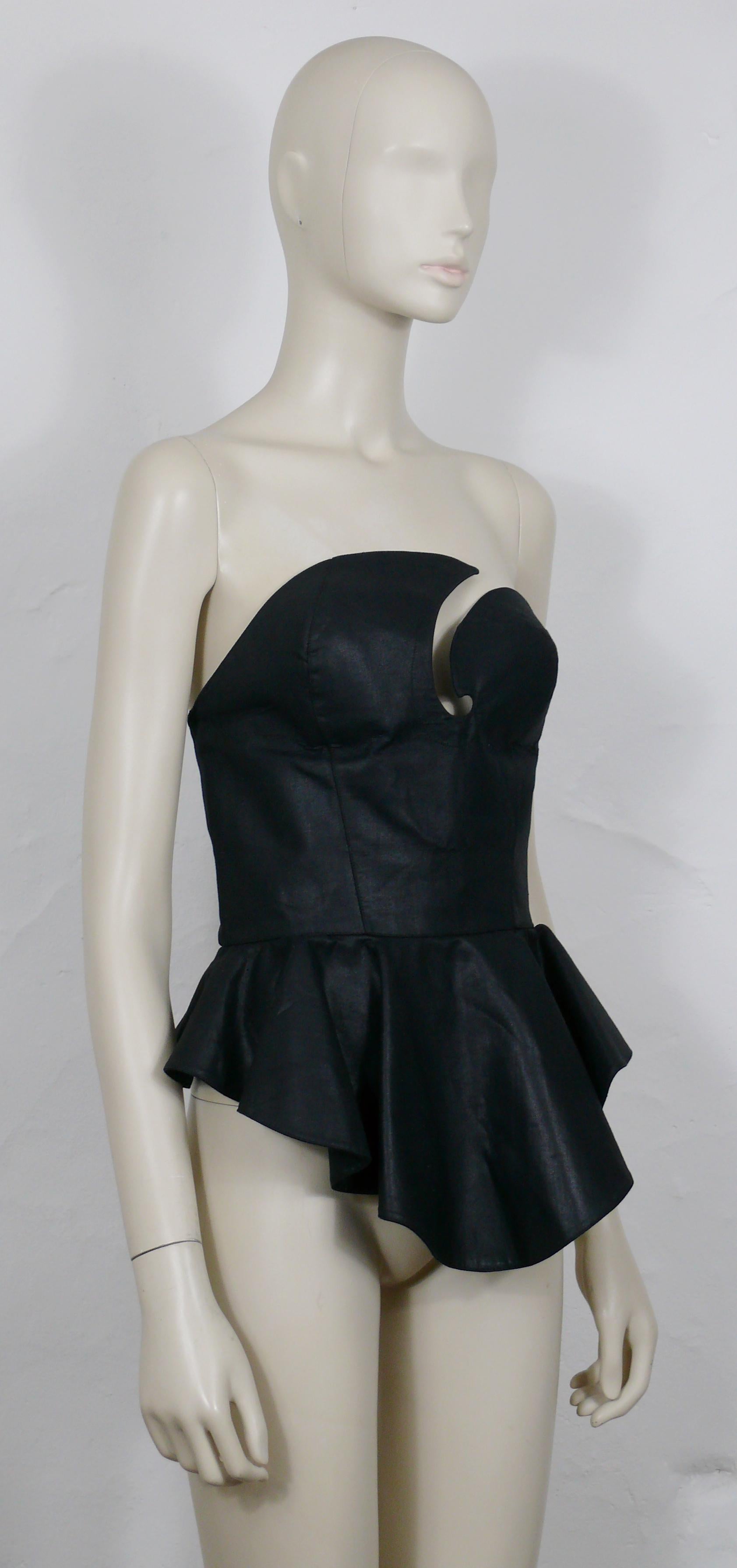 THIERRY MUGLER vintage iconic black bustier corset.

This bustier features :
- Black fabric (probably coated cotton).
- Asymetric bust.
- Basques.
- Back snap button down closure.
- Unlined. 

Label reads THIERRY MUGLER Paris.
Made in France.

Size
