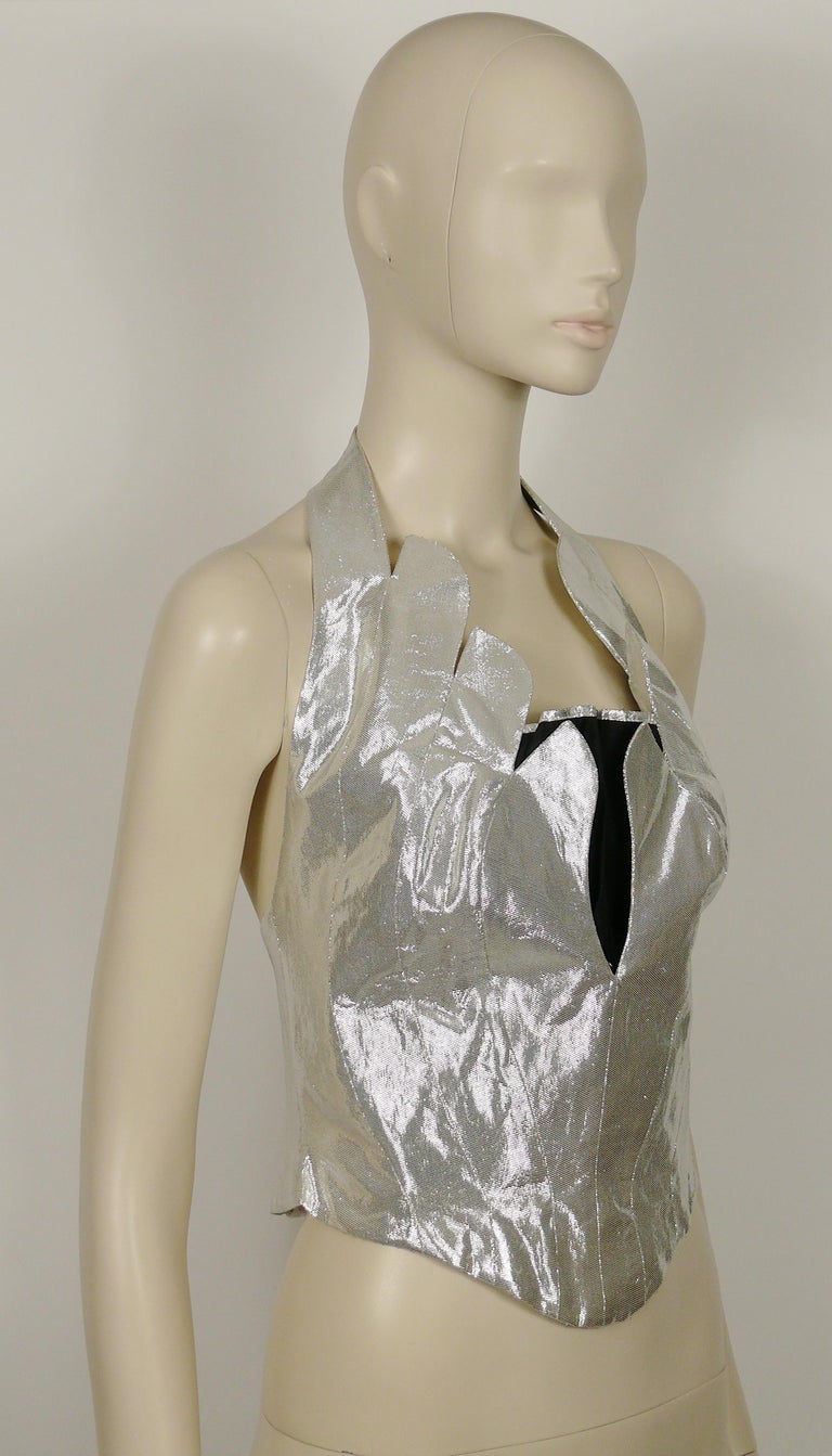 THIERRY MUGLER vintage iconic silver lame bustier corset with scalloped edges.

Snap button closure on the halter strap (2 extra buttons have been added / see the last photo).
Hook and eye loop closure at the back.

Label reads THIERRY MUGLER